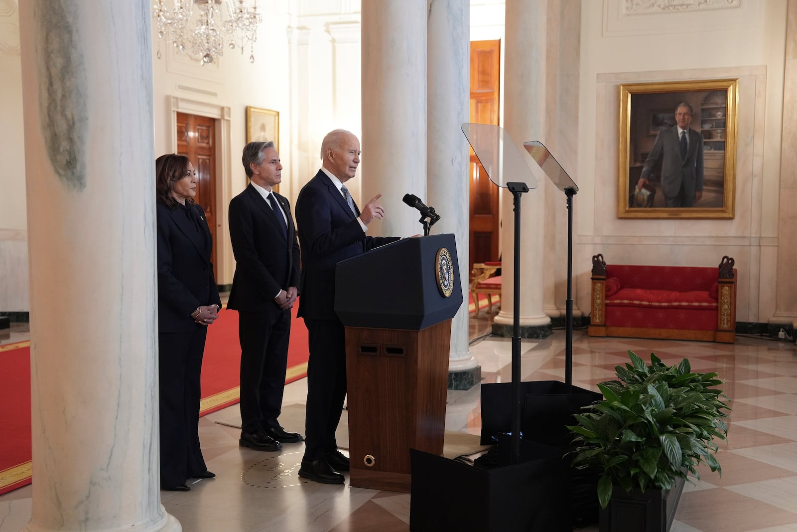 President Joe Biden, right, with Vice President Kamala Harris, left, and Sec. of State Anthony Blinken, center, speaks in the Cross Hall of the White House on the announcement of a ceasefire deal in Gaza and the release of dozens of hostages after more than 15 months of war, Wednesday, Jan. 15, 2025, in Washington. (AP Photo/Evan Vucci)