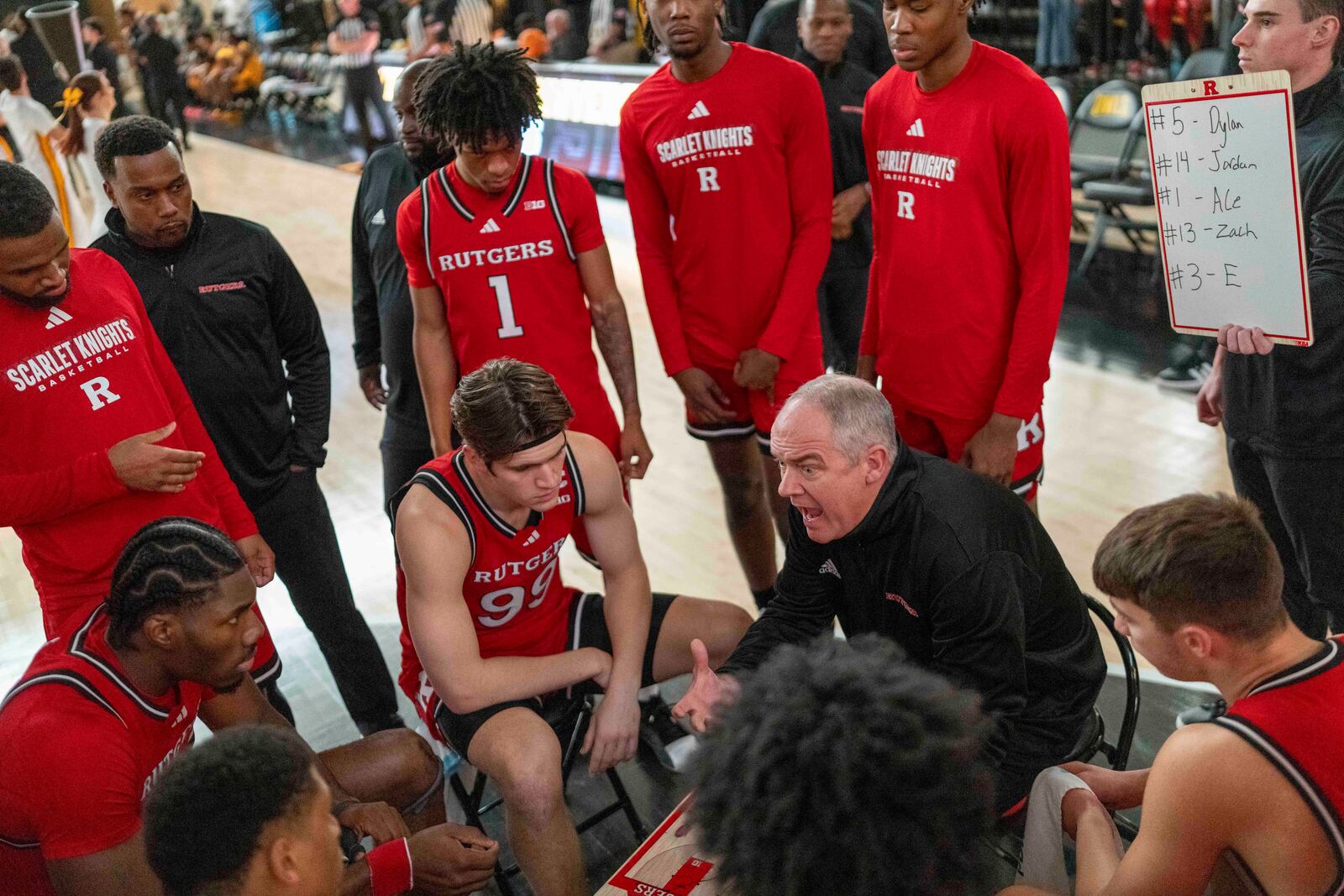 Rutgers head coach Steve Pikiell, center right, reacts during the first half of an NCAA college basketball game against Kennesaw State, Sunday, Nov. 24, 2024, in Kennesaw, Ga. (AP Photo/Erik Rank)