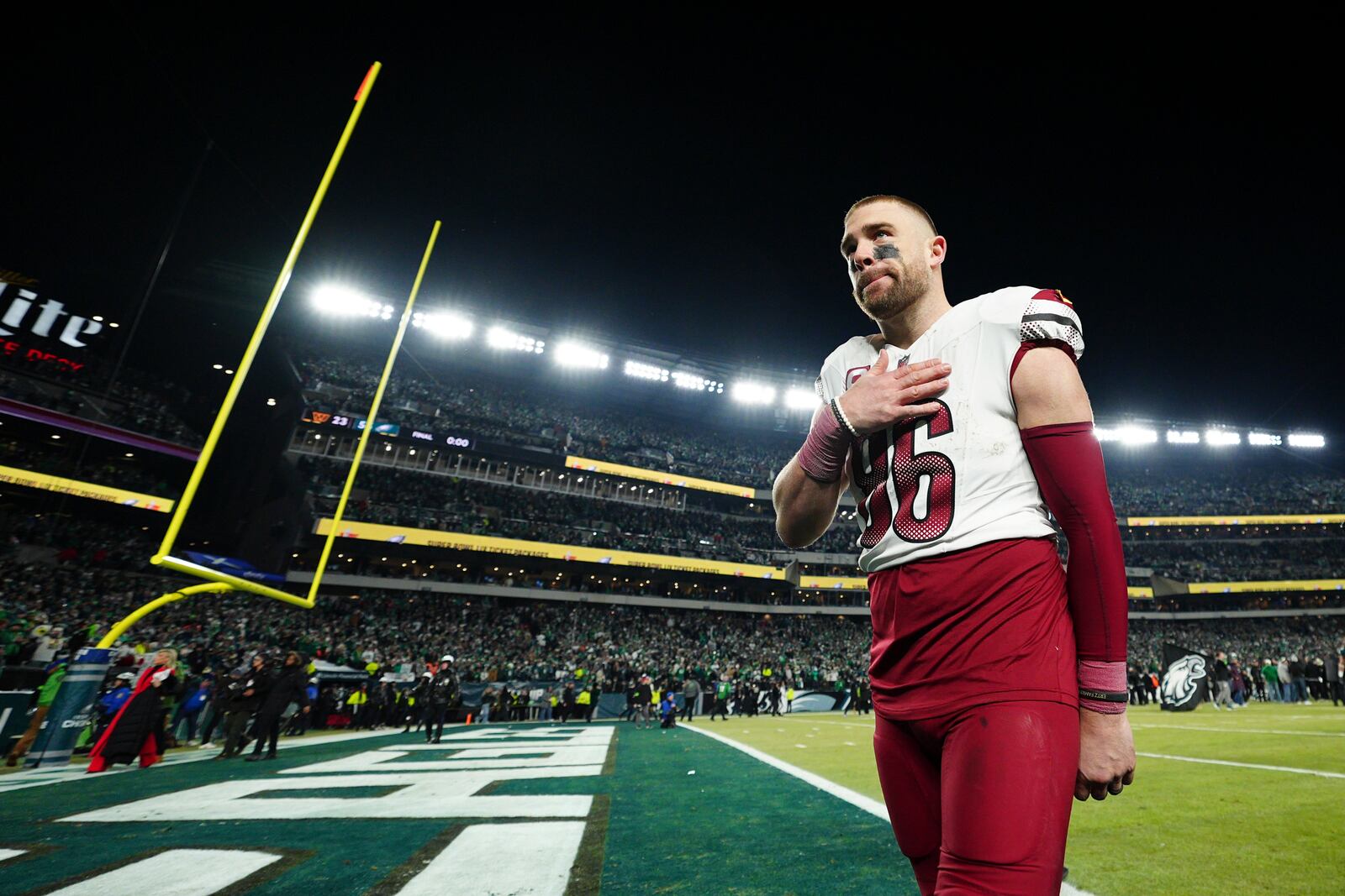 Washington Commanders' Zach Ertz leaves the field after losing the NFC Championship NFL football game against the Philadelphia Eagles, Sunday, Jan. 26, 2025, in Philadelphia. (AP Photo/Derik Hamilton)