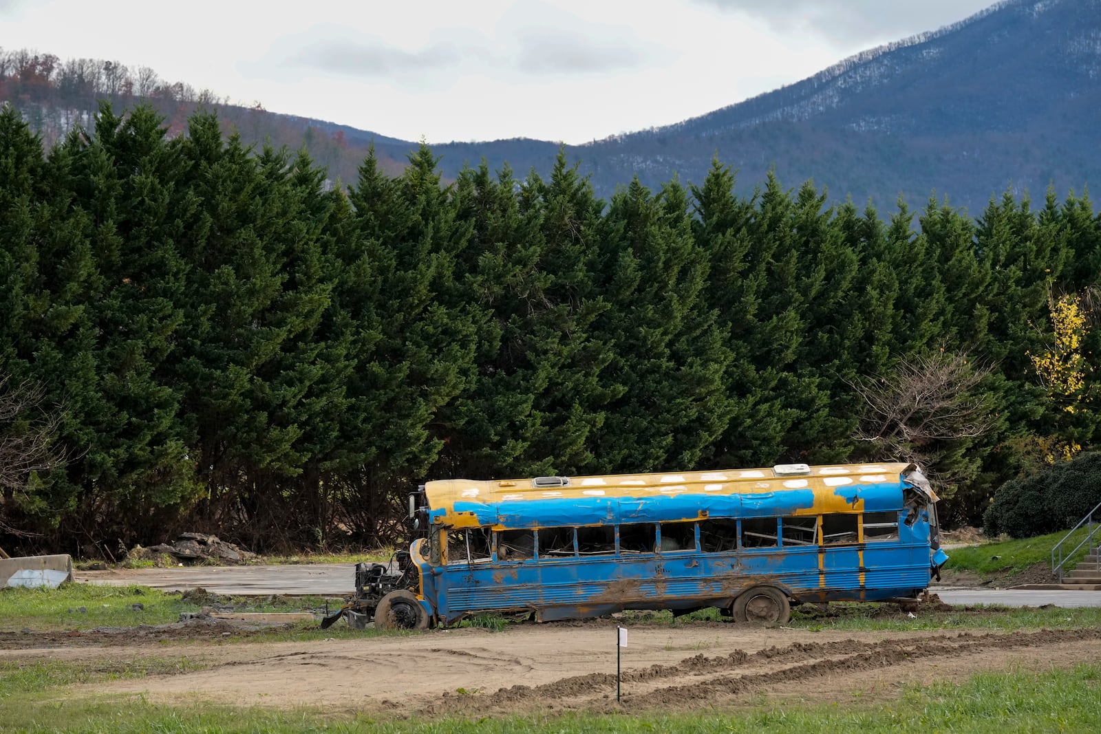 A damaged bus used for transporting whitewater rafters is seen Friday, Nov. 22, 2024, in Erwin, Tenn. (AP Photo/George Walker IV)