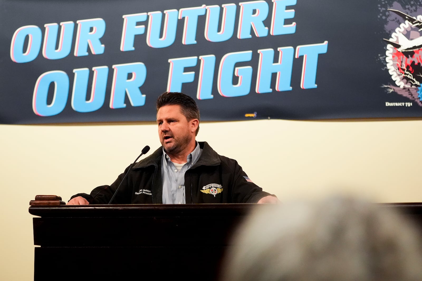 IAM District 751 president Jon Holden speaks to union members while announcing that they voted to accept a new contract offer from Boeing, Monday, Nov. 4, 2024, at their union Hall in Seattle. (AP Photo/Lindsey Wasson)