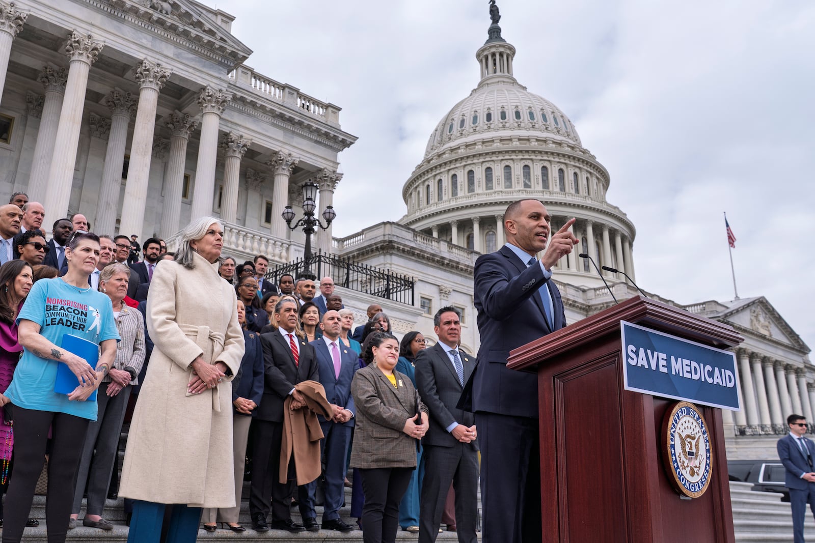 House Minority Leader Hakeem Jeffries, D-N.Y., right, joined at center left by Rep. Katherine Clark, D-Mass., the House minority whip, rallies Democrats against the Republican budget plan, on the House steps at the Capitol in Washington, Tuesday, Feb. 25, 2025. (AP Photo/J. Scott Applewhite)