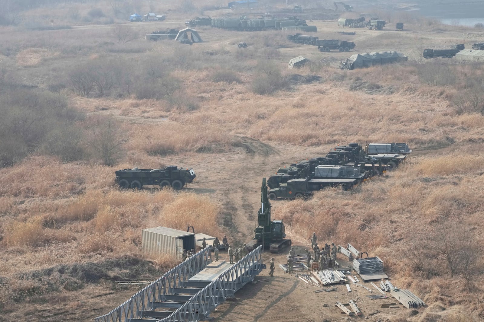 U.S. Army soldiers prepare to cross the Hantan river at a training field in Yeoncheon, South Korea, near the border with North Korea, Monday, March 10, 2025. (AP Photo/Ahn Young-joon)