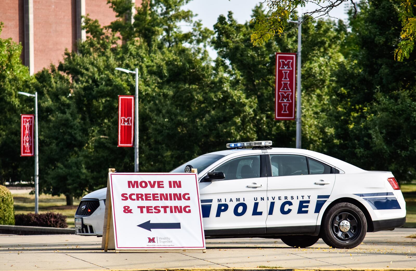 Cars line up for Covid-19 testing before students move in to dorms at Miami University Monday, Sept. 14, 2020 in Oxford. NICK GRAHAM / STAFF