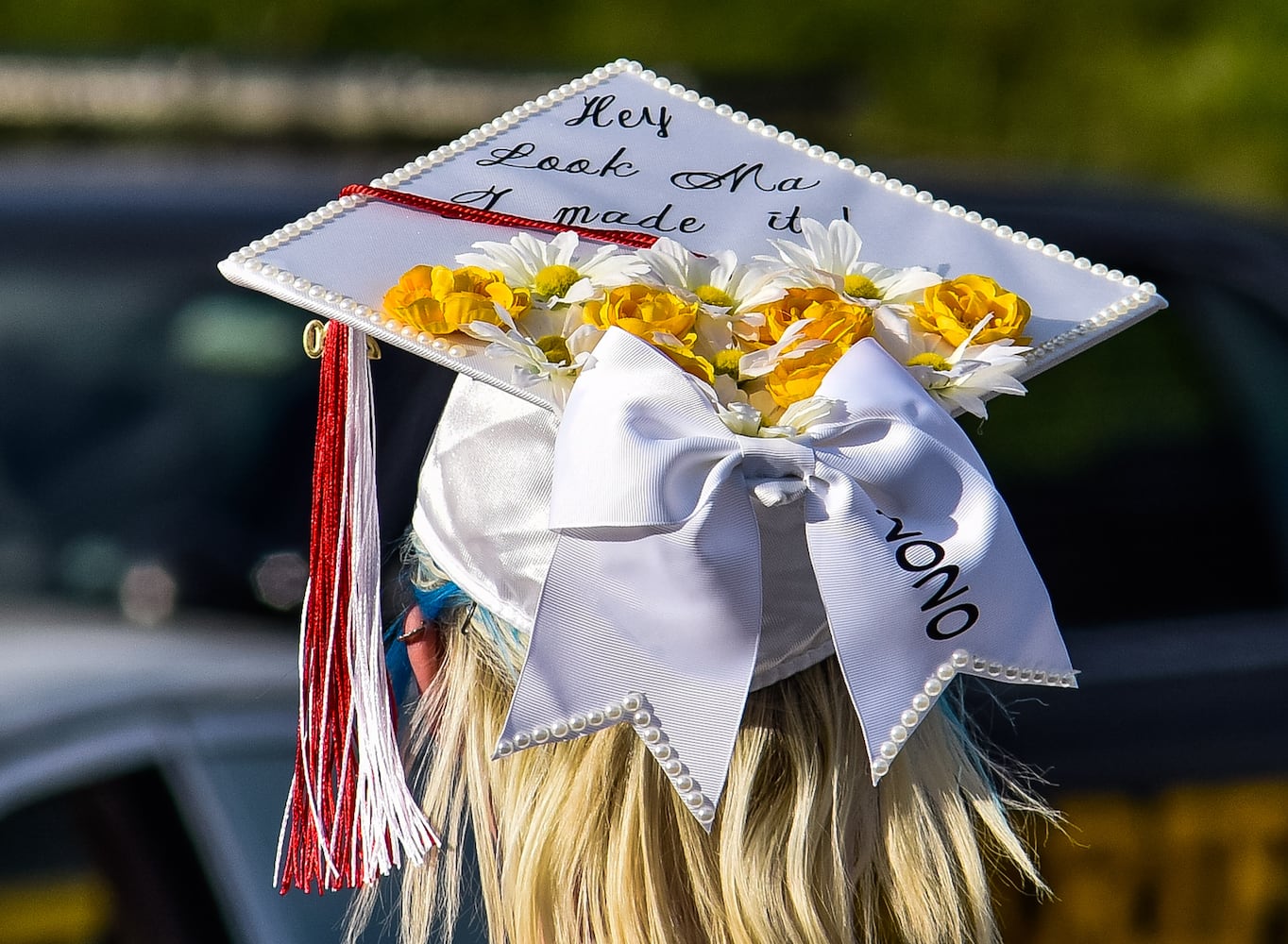 Madison High School drive-thru graduation ceremony at Land of Illusion