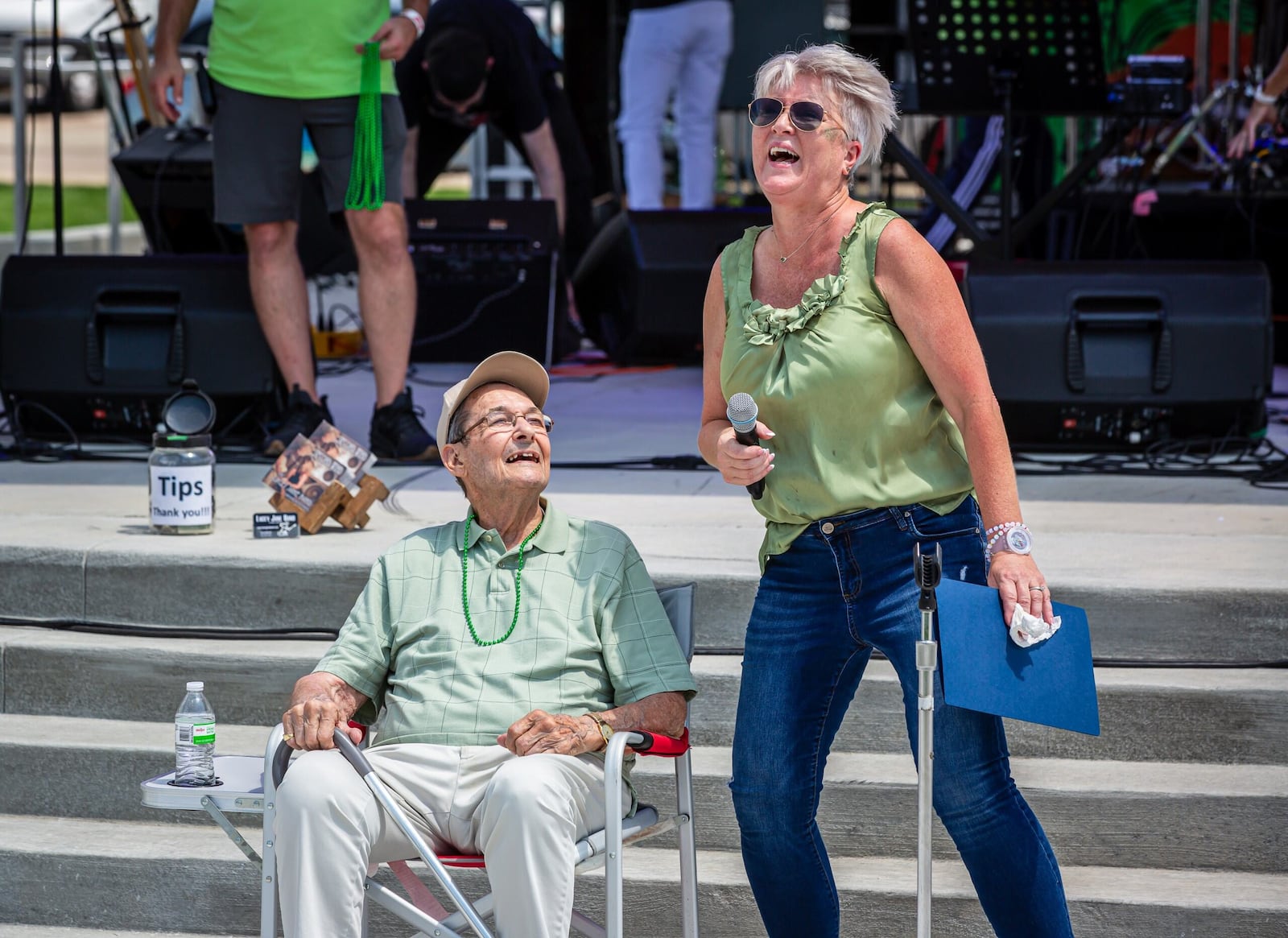 Ron Holp, founder of iconic downtown Miamisburg business Ron’s Pizza and one of the creators of the Rock ‘N’ Green Tomato Festival, was honored at the festival Saturday at the city’s new Riverfront Park. Miamisburg Mayor Michelle Collins (right) presented Holp with a proclamation. CONTRIBUTED