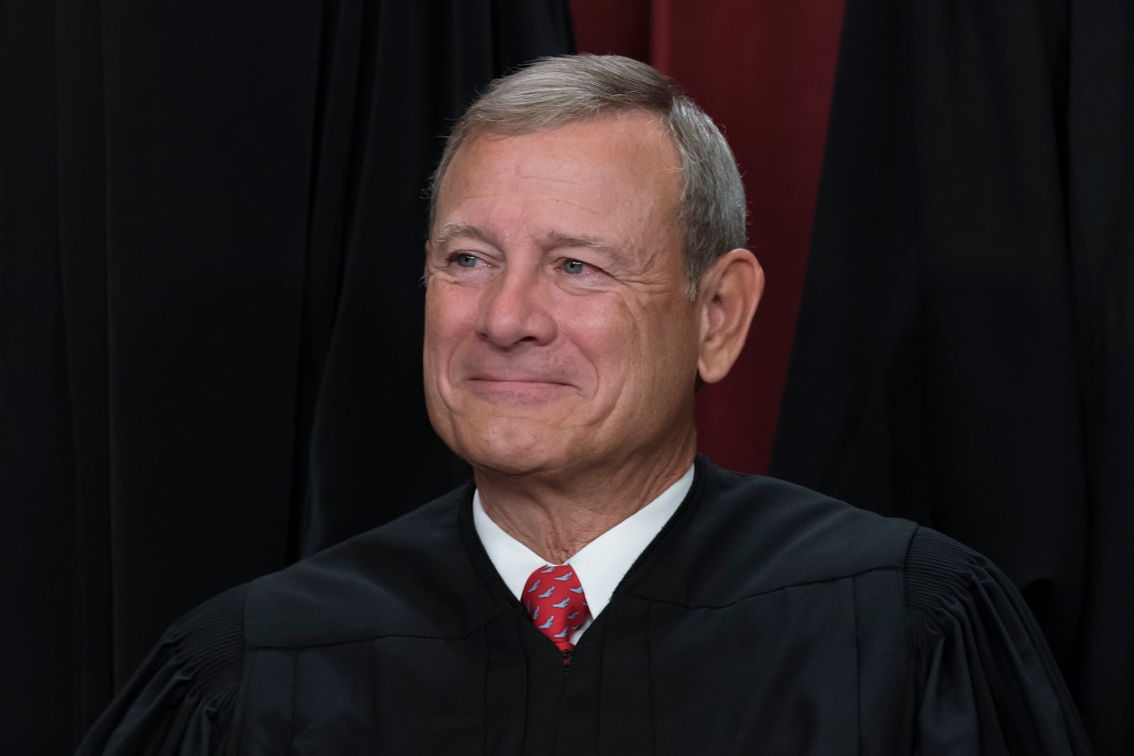 FILE - Chief Justice John Roberts joins other members of the Supreme Court as they pose for a new group portrait, at the Supreme Court building in Washington, Oct. 7, 2022. (AP Photo/J. Scott Applewhite, File)