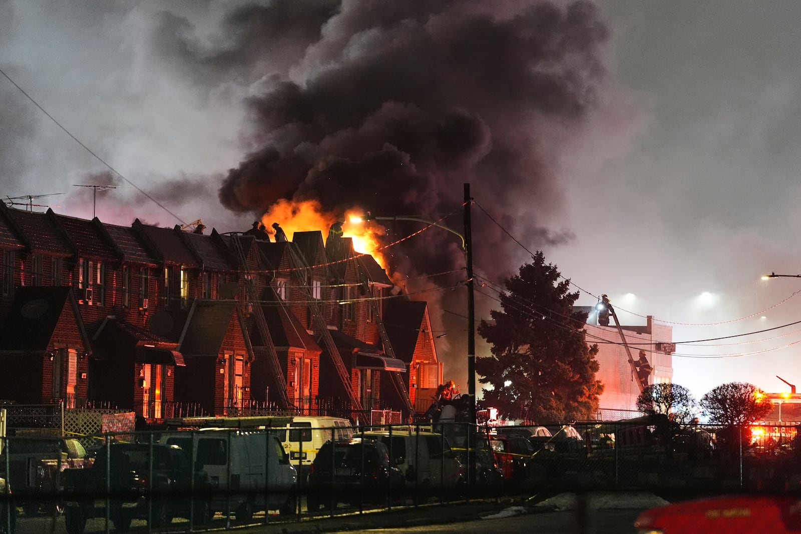 First responders work the scene after a small plane crashed in Philadelphia, Friday, Jan. 31, 2025. (AP Photo/Matt Rourke)