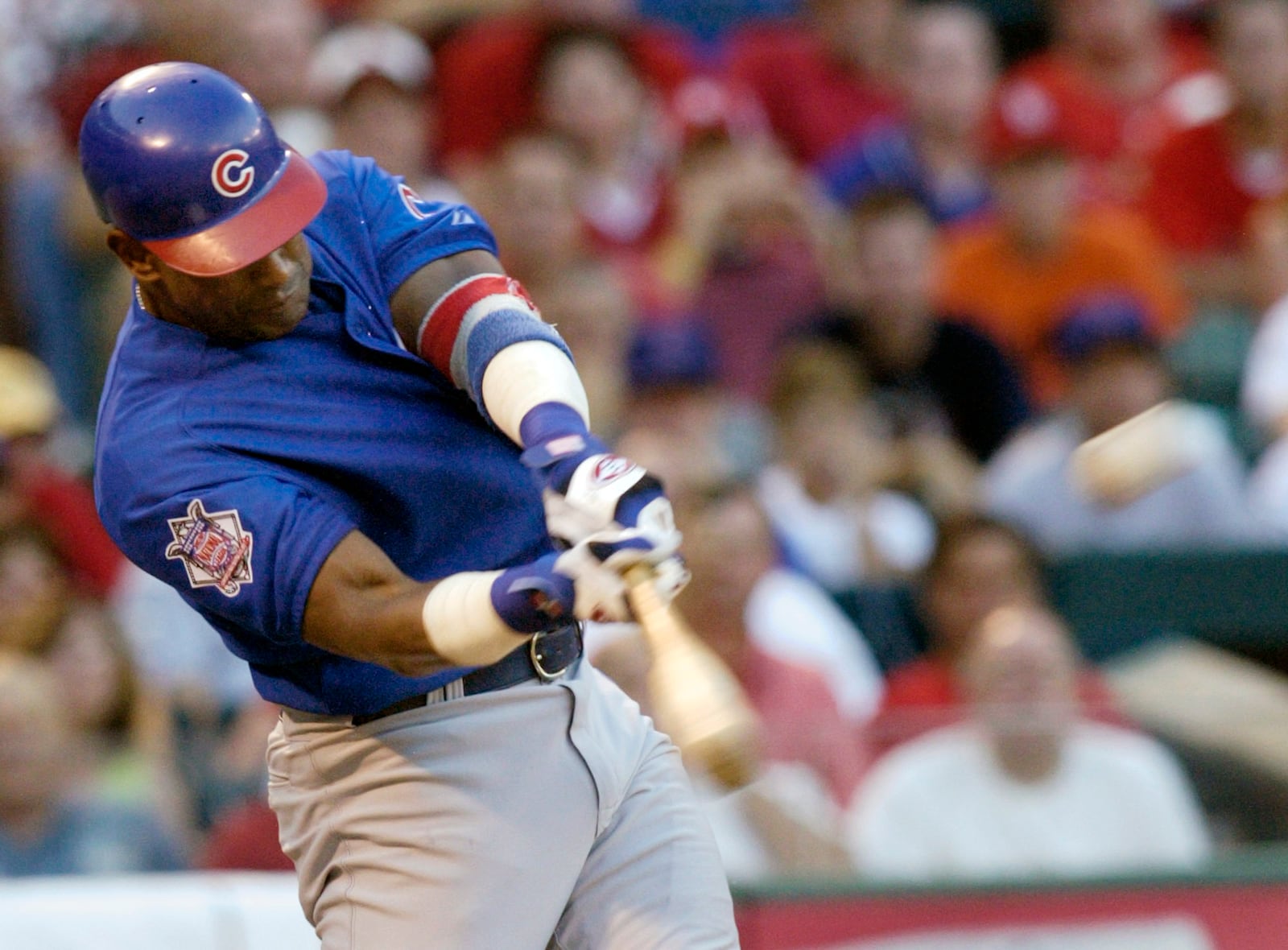 FILE - Chicago Cubs' Sammy Sosa connects for a three-run home run in the third ining against the St. Louis Cardinals Sunday, July 11, 2004 at Busch Stadium in St. Louis. (AP Photo/Tom Gannam, File)