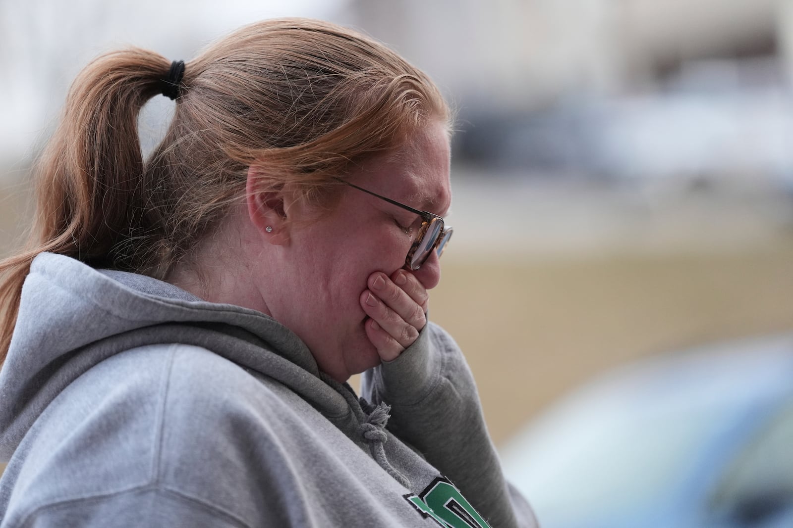 Leah Fauth gets emotional after leaving flowers in front of the West York Police Department after a police officer was killed responding to a shooting at UPMC Memorial Hospital in York, Pa. on Saturday, Feb. 22, 2025. (AP Photo/Matt Rourke)