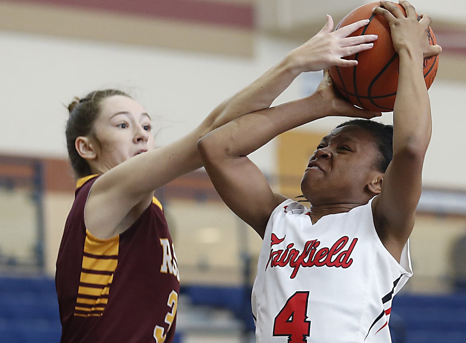 Fairfield guard Zahyra Bailey has her shot blocked by Ross guard Julia Nunn during the All-Butler County All-Star girls basketball game at the Hamilton Athletic Center on April 7. CONTRIBUTED PHOTO BY E.L. HUBBARD