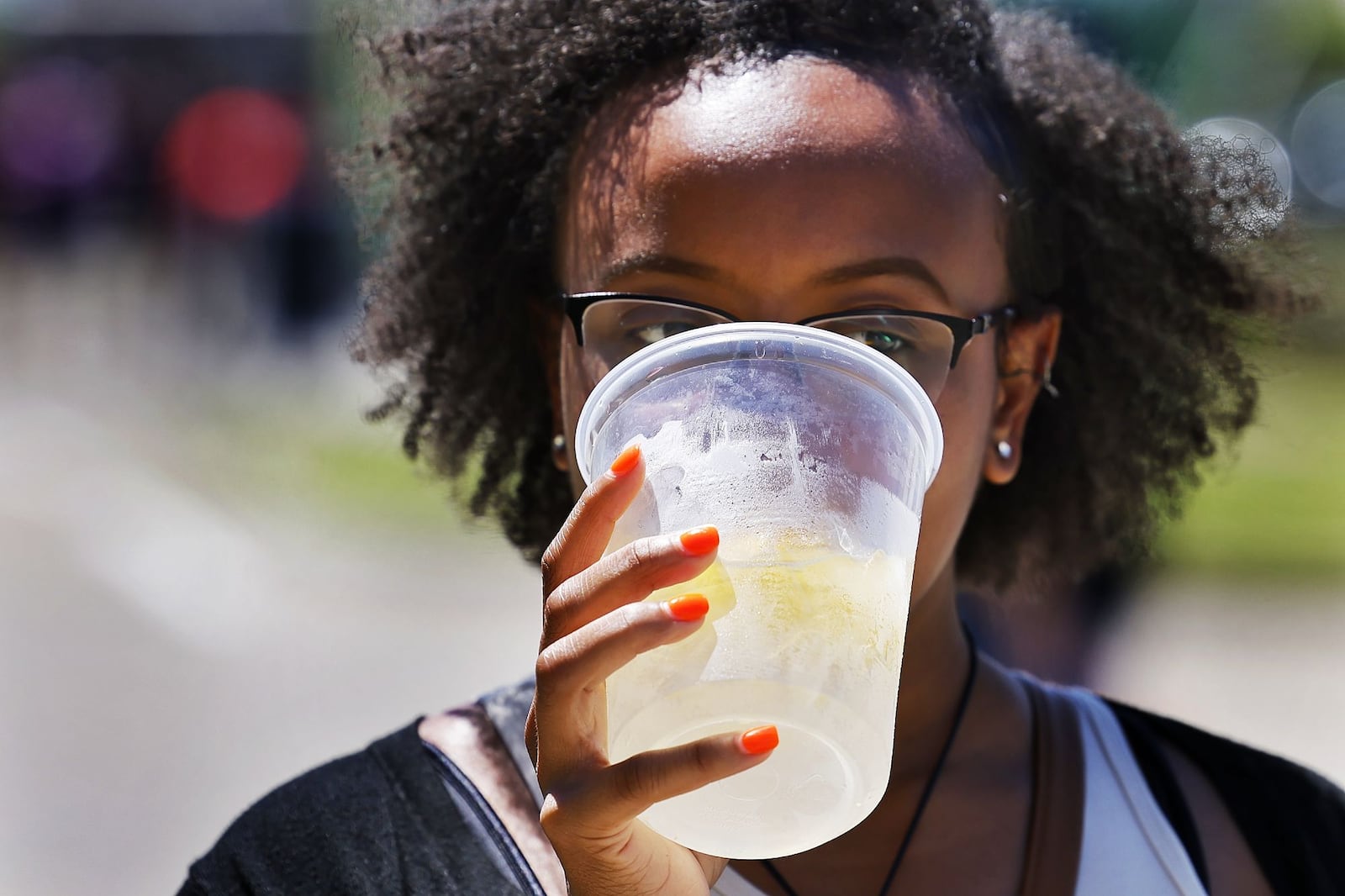 Alexa Lopez cools off with a lemonade at the 9th annual Union Centre Food Truck Rally Friday, Aug. 12, 2022 at The Square @ Union Centre in West Chester Township. NICK GRAHAM/STAFF