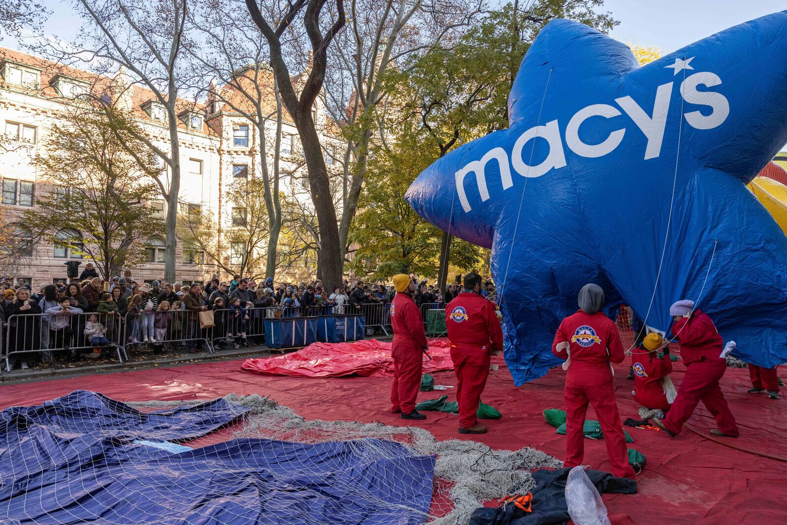 People inflate a float of Macy's Stars in preparation for the Macy's Thanksgiving Day Parade, Wednesday, Nov. 27, 2024, in New York. (AP Photo/Yuki Iwamura)