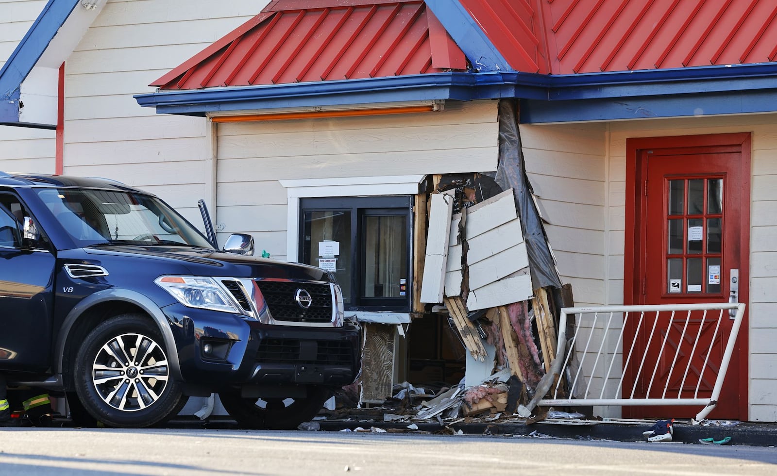 A vehicle crashed inro Jocko's Chicken and Seafood on Hogh Street in Hamilton Wednesday, Dec. 27, 2023. NICK GRAHAM/STAFF