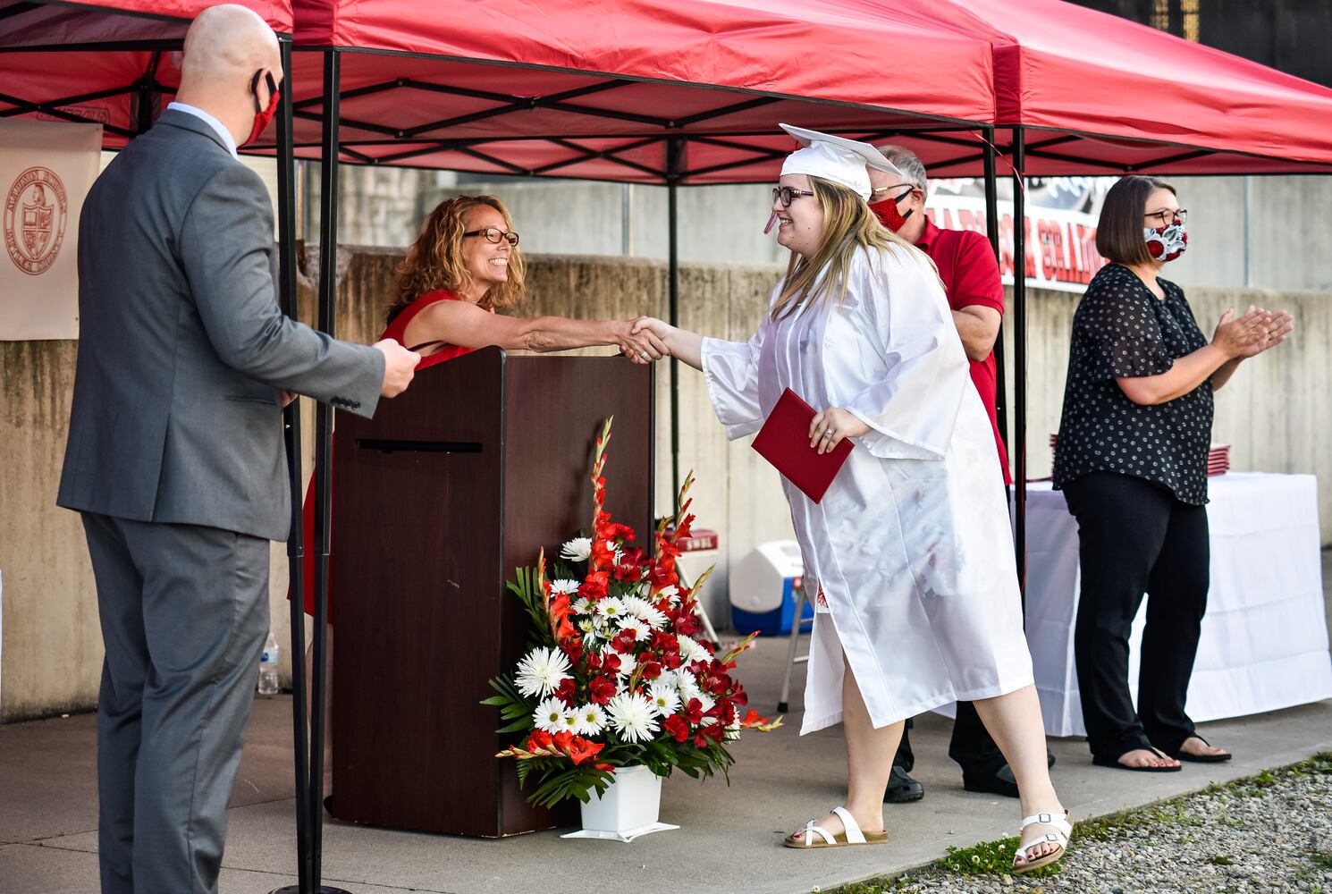 Madison High School drive-thru graduation ceremony at Land of Illusion