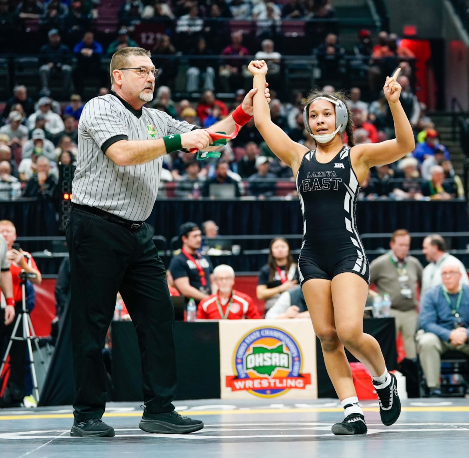 Lakota East wrestler Cam Gresham wins a match during the Ohio High School Athletic Association Division I state tournament. Photo by Justin Tackett