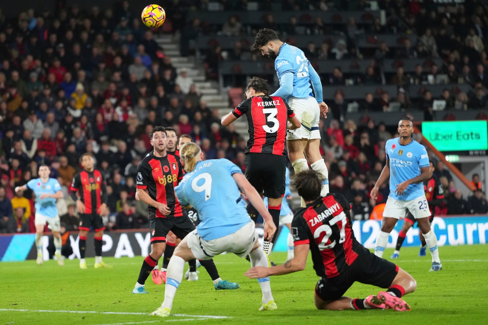 Manchester City's Josko Gvardiol, top right, heads the ball and scores his sides first goal during the English Premier League soccer match between Bournemouth and Manchester City at the Vitality stadium in Bournemouth, England, Saturday, Nov. 2, 2024. (AP Photo/Kirsty Wigglesworth)