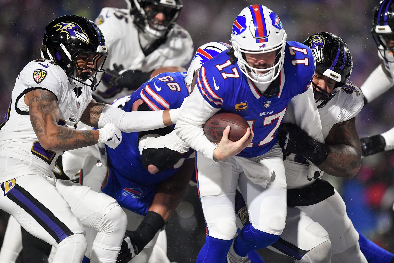 Buffalo Bills quarterback Josh Allen (17) carries the ball into the end zone to score a touchdown against the Baltimore Ravens during the second quarter of an NFL divisional playoff football game, Sunday, Jan. 19, 2025, in Orchard Park, N.Y. (AP Photo/Adrian Kraus)