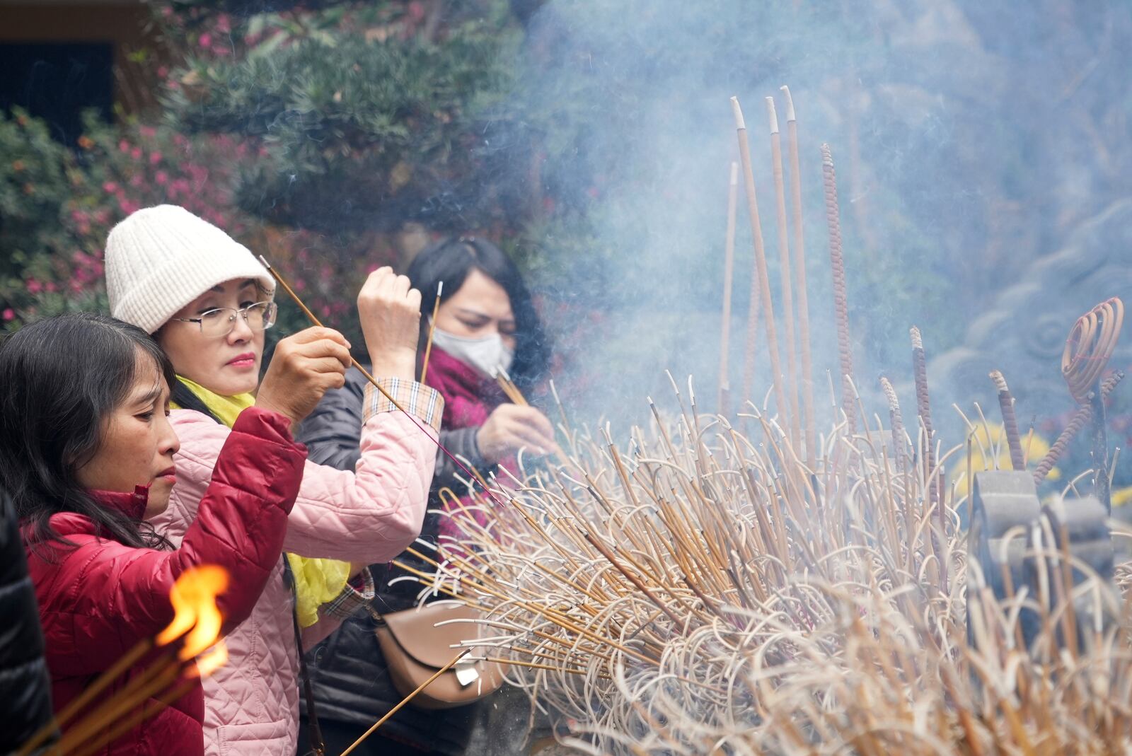 People place incenses at Quan Su pagoda on the first day of the Lunar New Year in Hanoi, Vietnam Wednesday, Jan. 29, 2025. (AP Photo/Hau Dinh)