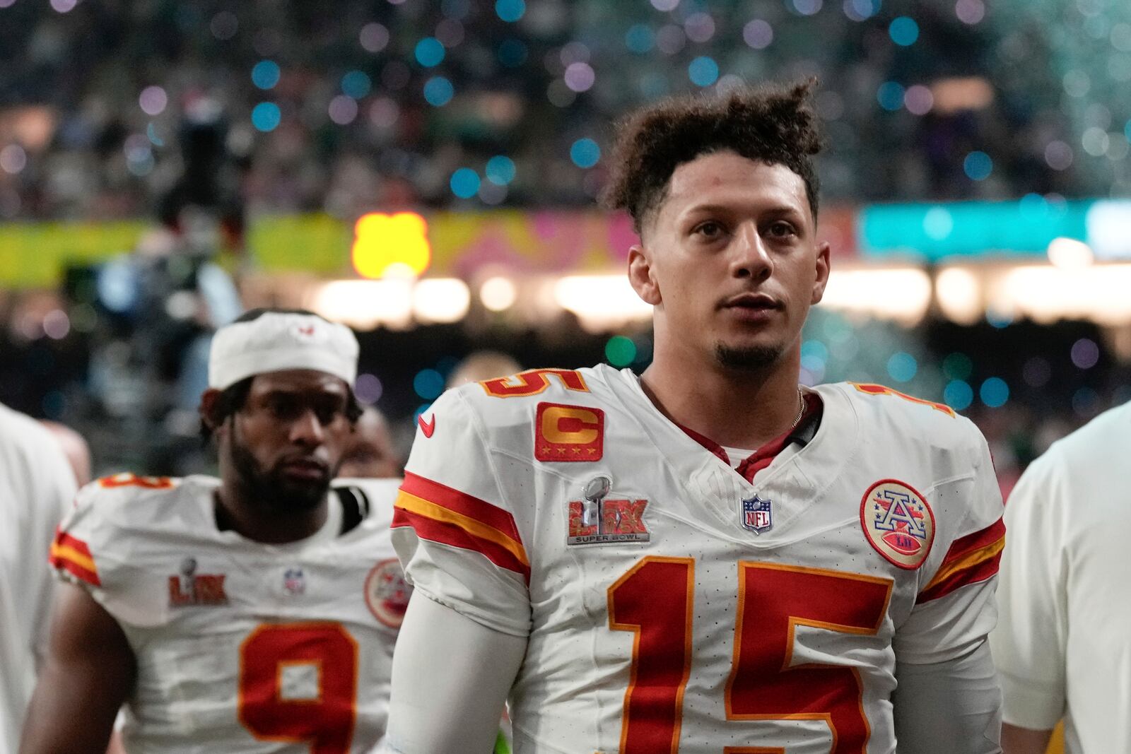 Kansas City Chiefs quarterback Patrick Mahomes (15) and wide receiver JuJu Smith- Schuster (9) walk off the field after a loss to the Philadelphia Eagles during the NFL Super Bowl 59 football game, Sunday, Feb. 9, 2025, in New Orleans. (AP Photo/Abbie Parr)