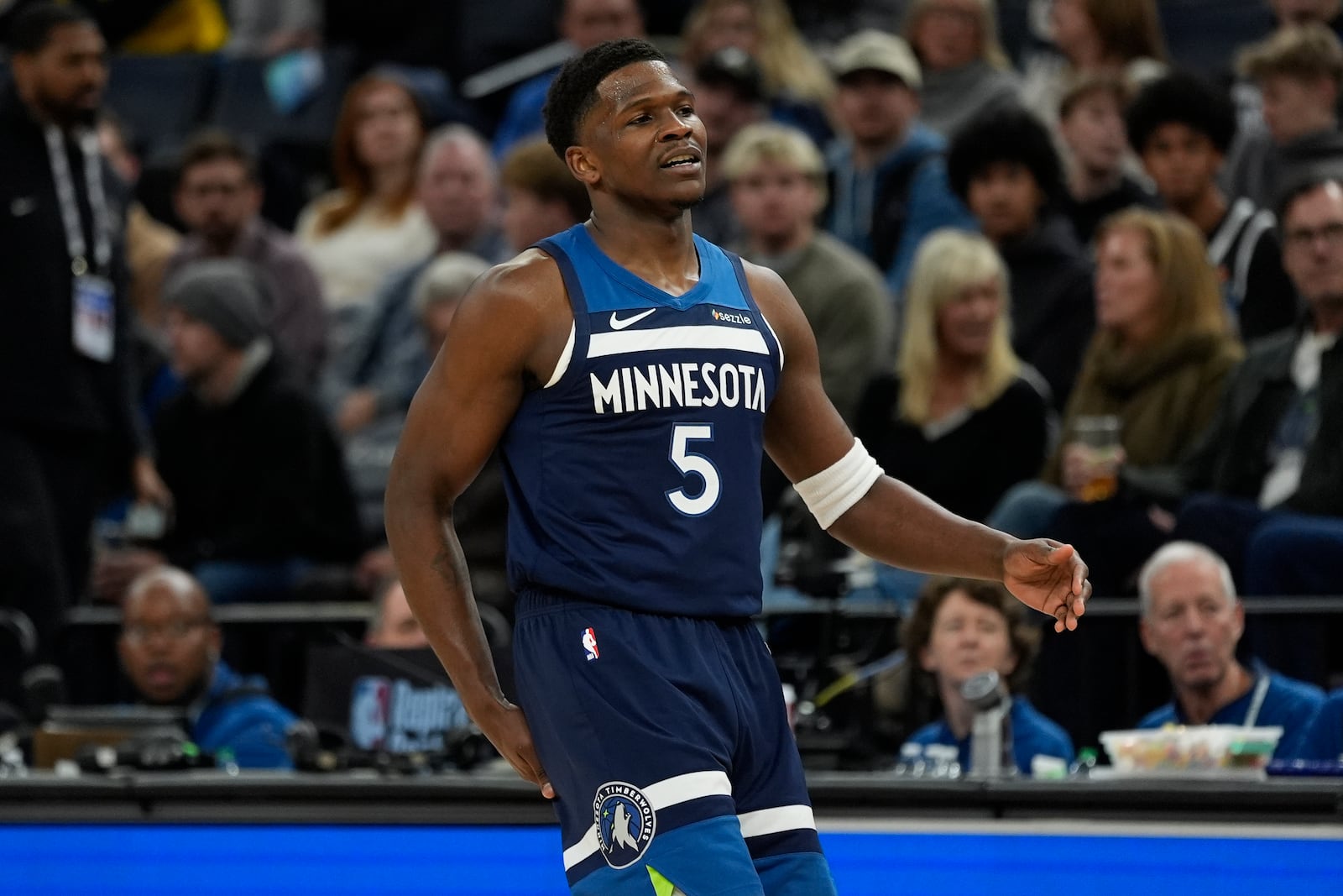 Minnesota Timberwolves guard Anthony Edwards reacts after missing a shot during the first half of an NBA basketball game against the Los Angeles Lakers, Friday, Dec. 13, 2024, in Minneapolis. (AP Photo/Abbie Parr)