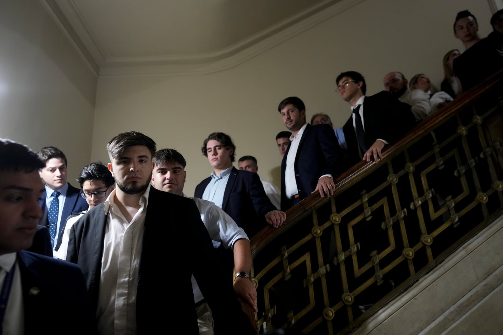 Special guests leave the Congress after Argentina's President Javier Milei delivered the annual State of the Nation address, which marks the start of the legislative year, in Buenos Aires, Argentina, Saturday, March 1, 2025. (AP Photo/Rodrigo Abd)