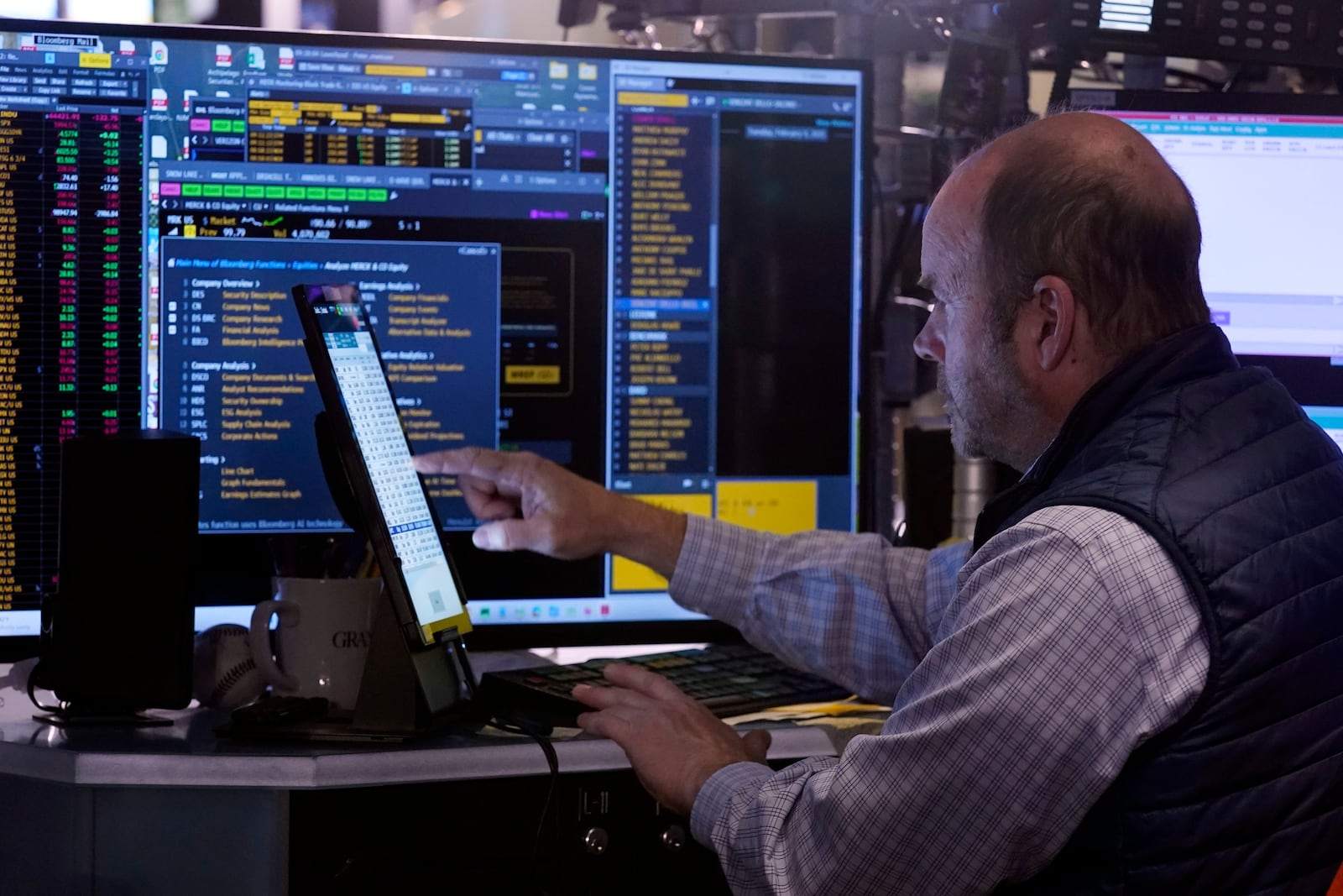 Trader Peter Mancuso works on the floor of the New York Stock Exchange, Tuesday, Feb. 4, 2025. (AP Photo/Richard Drew)