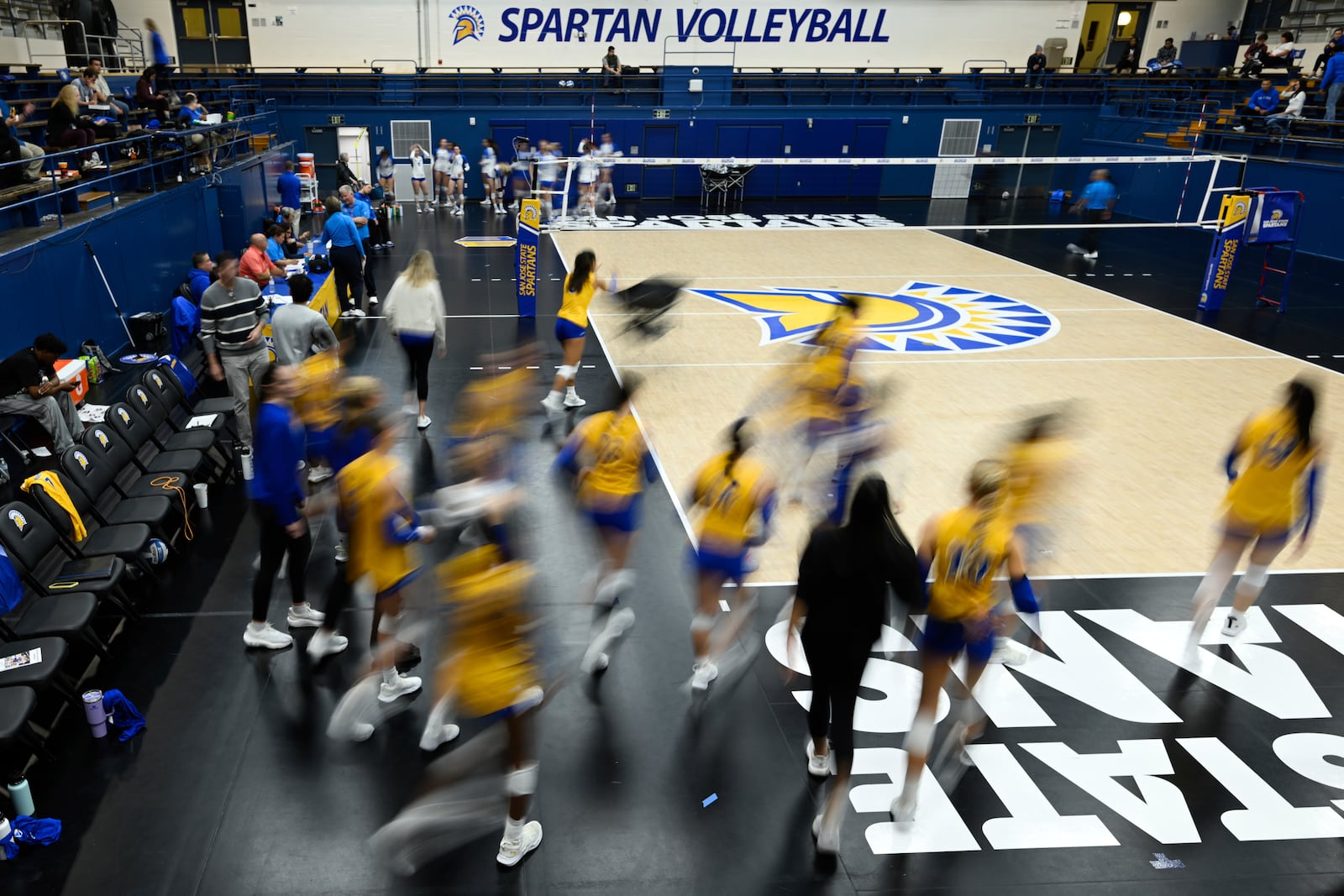 FILE -The San Jose State players take the court for warm ups before an NCAA women's college volleyball match against Air Force, Thursday, Oct. 31, 2024, in San Jose, Calif. (AP Photo/Eakin Howard, File)