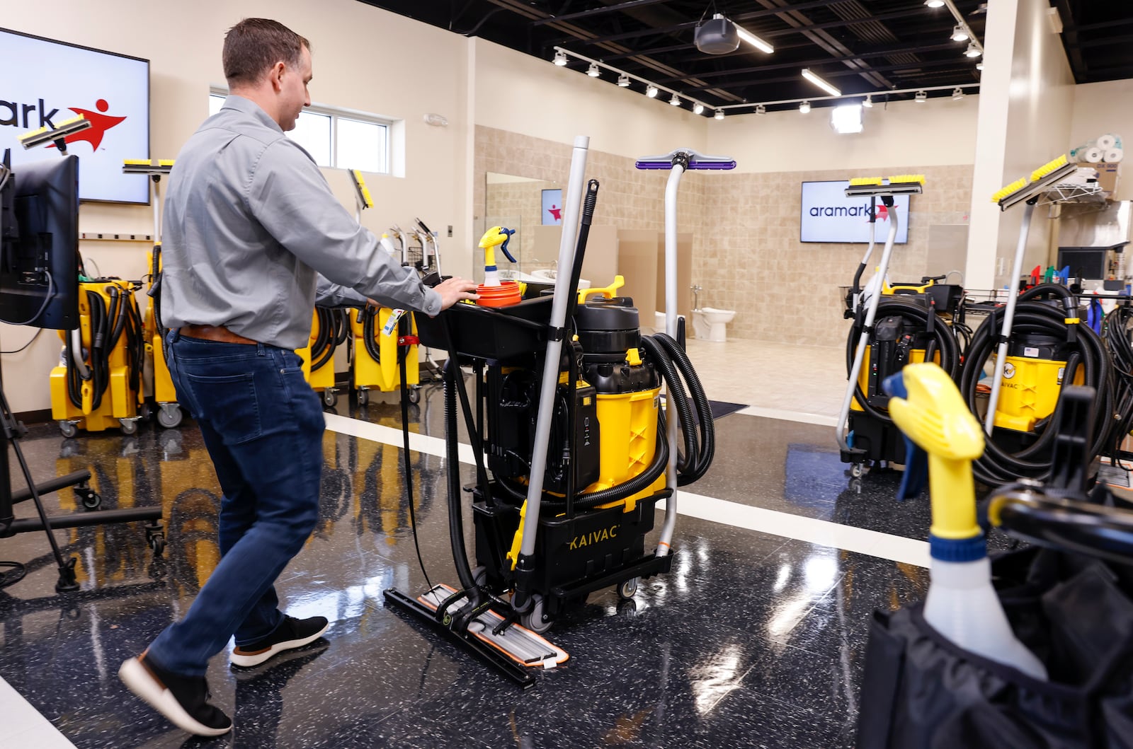 Jim Pickrel, director of marketing with Kaivac, shows off their all floor machine in the demo training room Wednesday, Aug. 7, 2024 in Hamilton. Kaivac designs and manufactures a variety of specialty cleaning machines in their Hamilton facility. NICK GRAHAM/STAFF