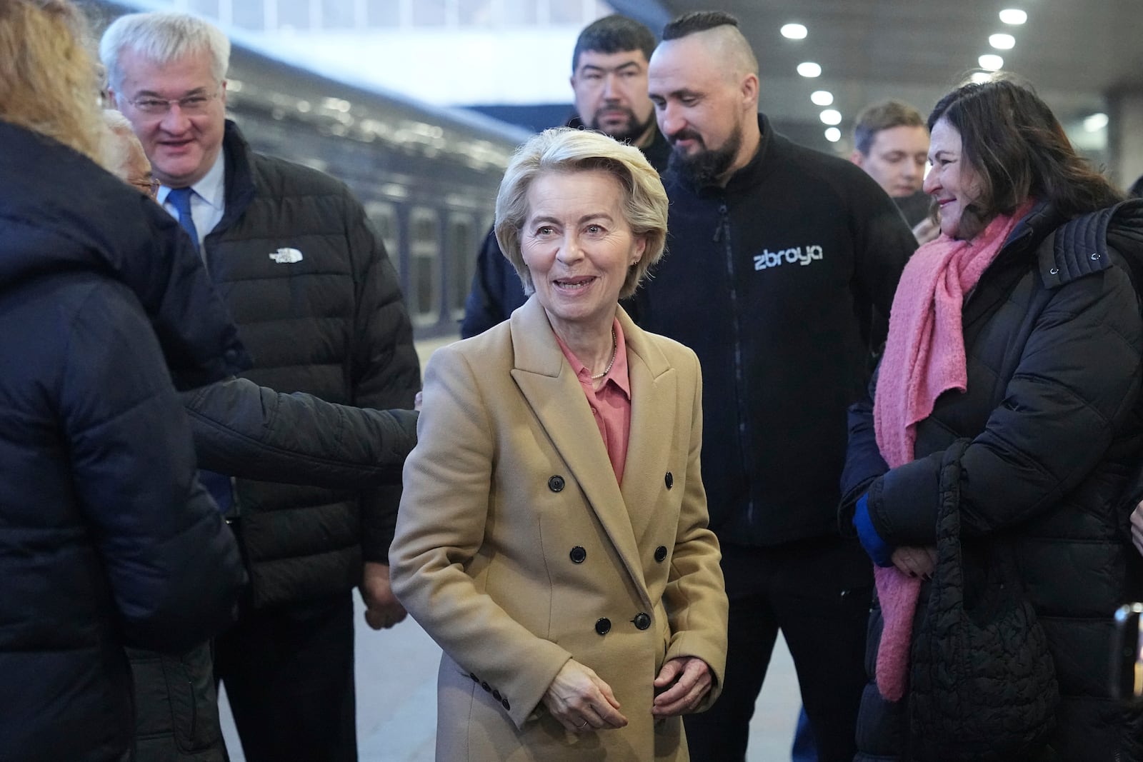 European Commission President Ursula von der Leyen, center, arrives at a train station on the third anniversary of the Russian invasion of Ukraine, Kyiv, Ukraine, Monday, Feb. 24, 2025. (AP Photo/Efrem Lukatsky)