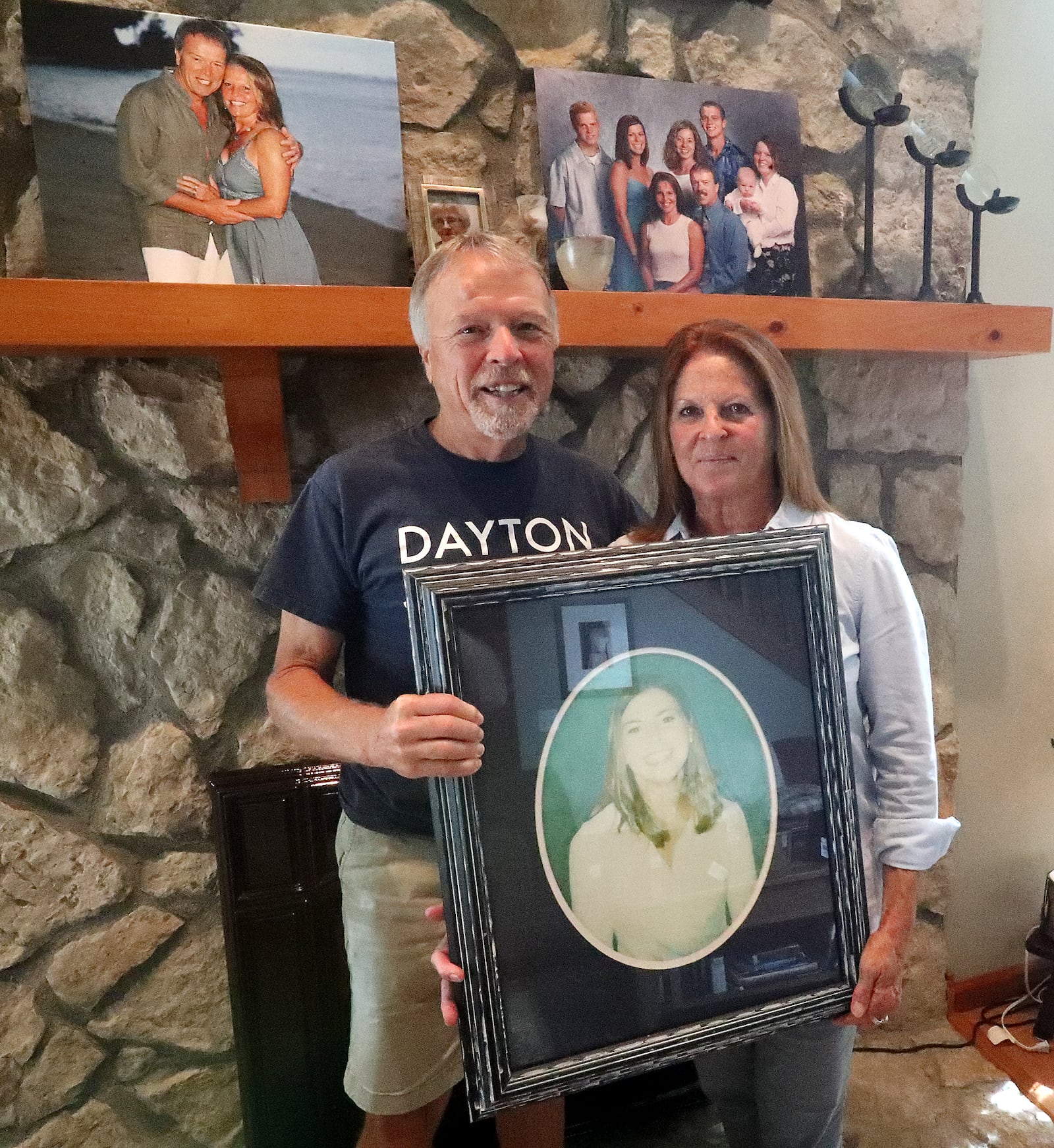 Bev and John Titus with a picture of their daughter, Alicia, who was a flight attendant on one of planes that struck the World Trade Center on 9/11. BILL LACKEY/STAFF