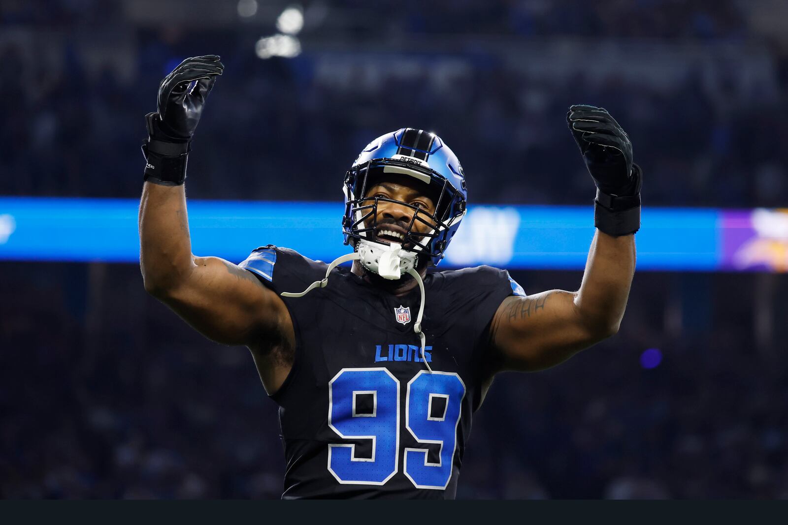 Detroit Lions defensive end Za'Darius Smith (99) celebrates after he sacked Minnesota Vikings quarterback Sam Darnold during the first half of an NFL football game Sunday, Jan. 5, 2025, in Detroit. (AP Photo/Rey Del Rio)