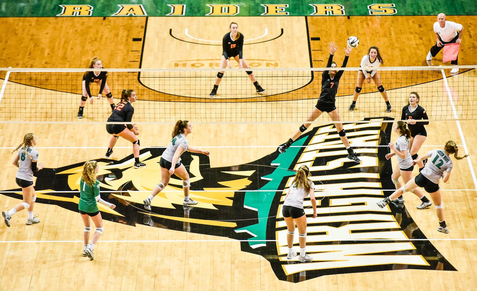 Fenwick’s Elizabeth Hoerlein (7) rises for a block during Friday’s Division II state volleyball semifinal against Parma Heights Holy Name at Wright State University’s Nutter Center. NICK GRAHAM/STAFF