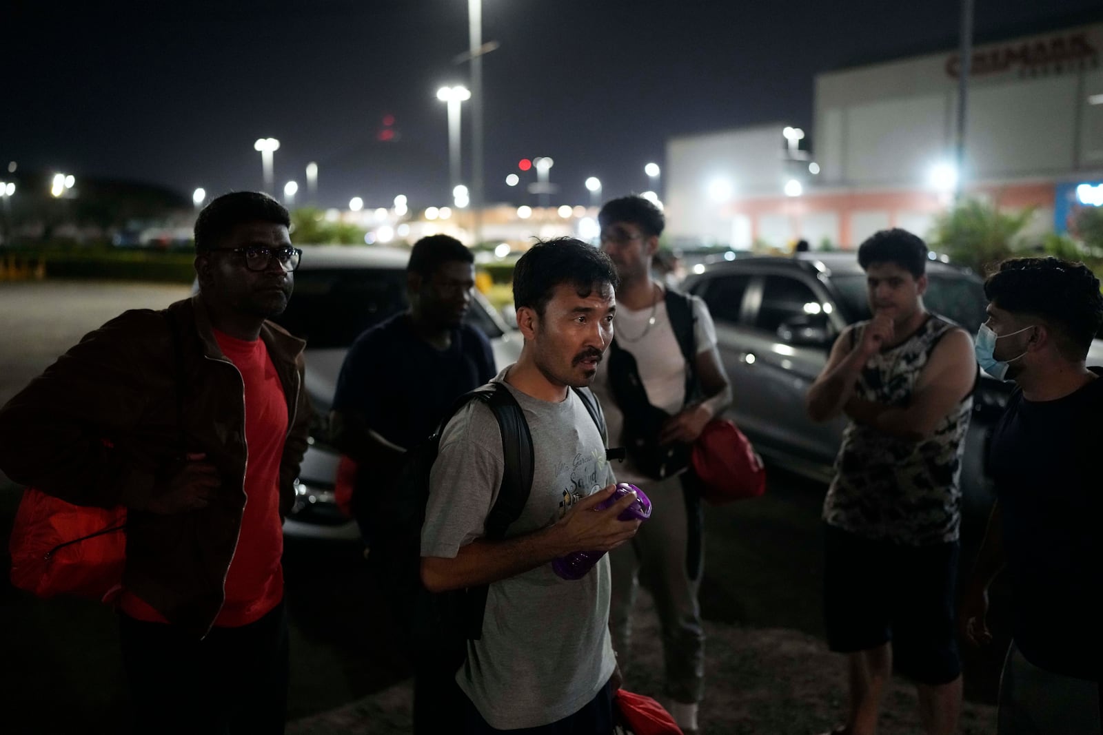 Hayatullah Omagh, of Afghanistan, and other migrants who were held in a Panamanian immigration temporary shelter after being deported from the U.S. arrive in Panama City, Saturday, March 8, 2025, after authorities gave them 30 days to leave the country. (AP Photo/Matias Delacroix)