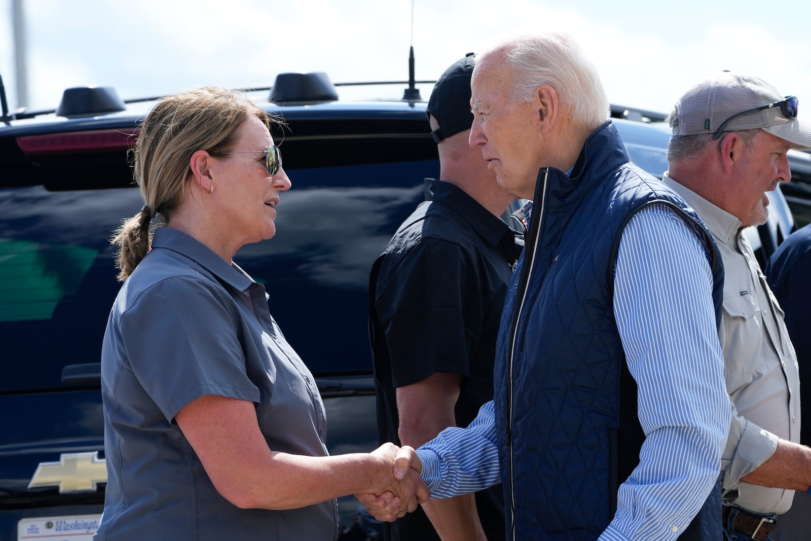 President Joe Biden talks with Deanne Criswell, Administrator of the Federal Emergency Management Agency (FEMA), as he arrives at Greenville-Spartanburg International Airport in Greer, S.C., Wednesday, Oct. 2, 2024, to survey damage from Hurricane Helene. (AP Photo/Susan Walsh)