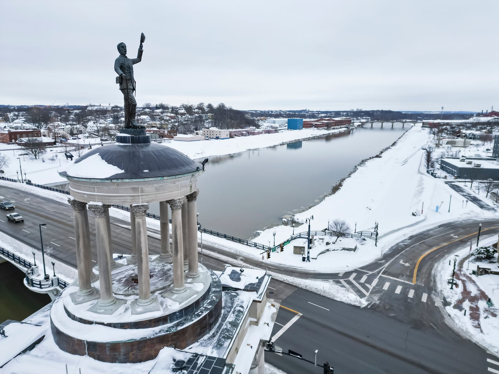 The Billy Yank statue atop the Soldiers, Sailors and Pioneers Monument overlooks a snow cover downtown Tuesday morning, Jan. 7, 2025 in Hamilton. NICK GRAHAM/STAFF