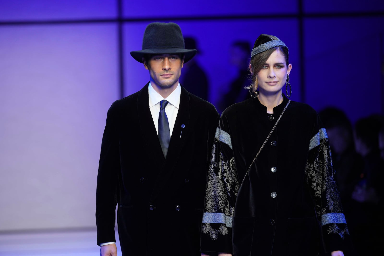 Models wear creations part of the men's Giorgio Armani Fall-Winter 2025-2026 collection, that was presented in Milan, Italy, Monday, Jan. 20, 2025. (AP Photo/Antonio Calanni)