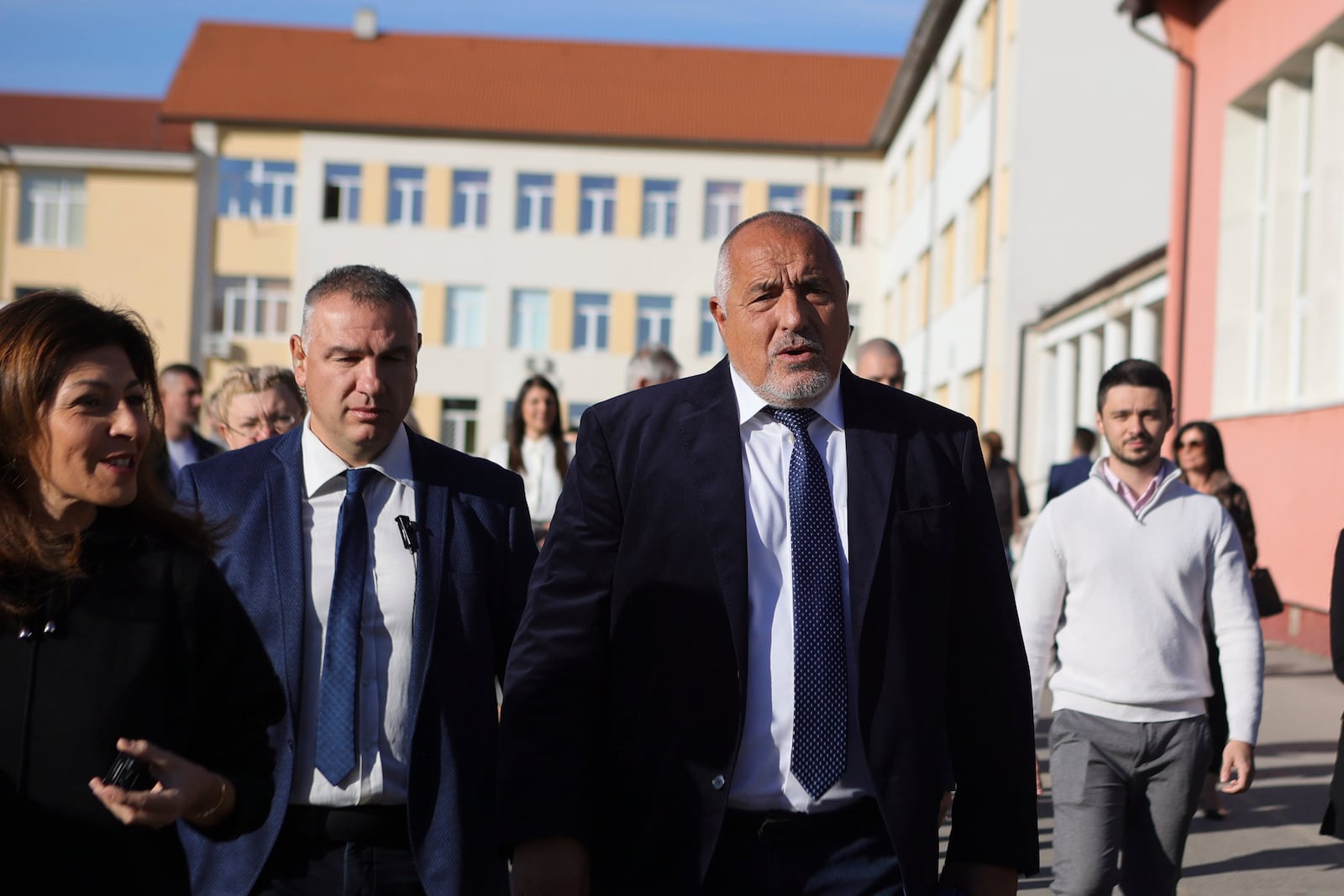 Former Bulgarian Prime Minister Boyko Borissov walks after casting his ballot at a polling station during general elections in Bankya, Bulgaria, Sunday, Oct. 27, 2024. (AP Photo/Valentina Petrova)