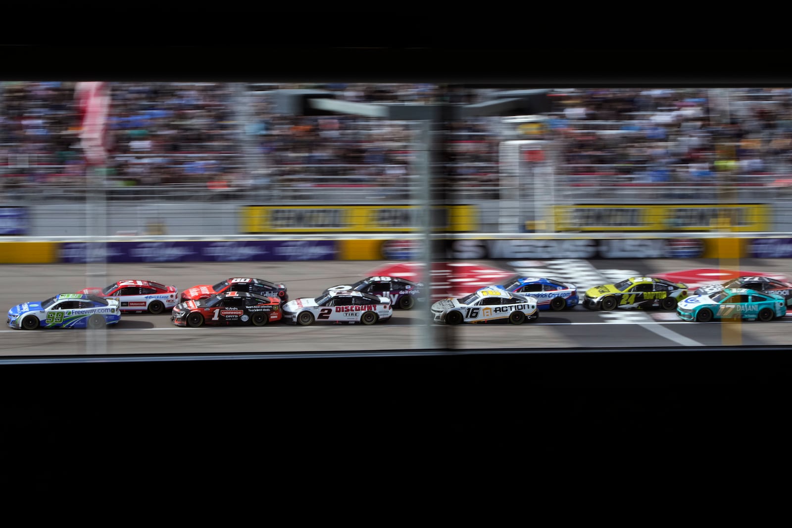 Drivers restart racing after a yellow flag during a NASCAR Cup Series auto race Sunday, March 16, 2025, in Las Vegas. (AP Photo/John Locher)