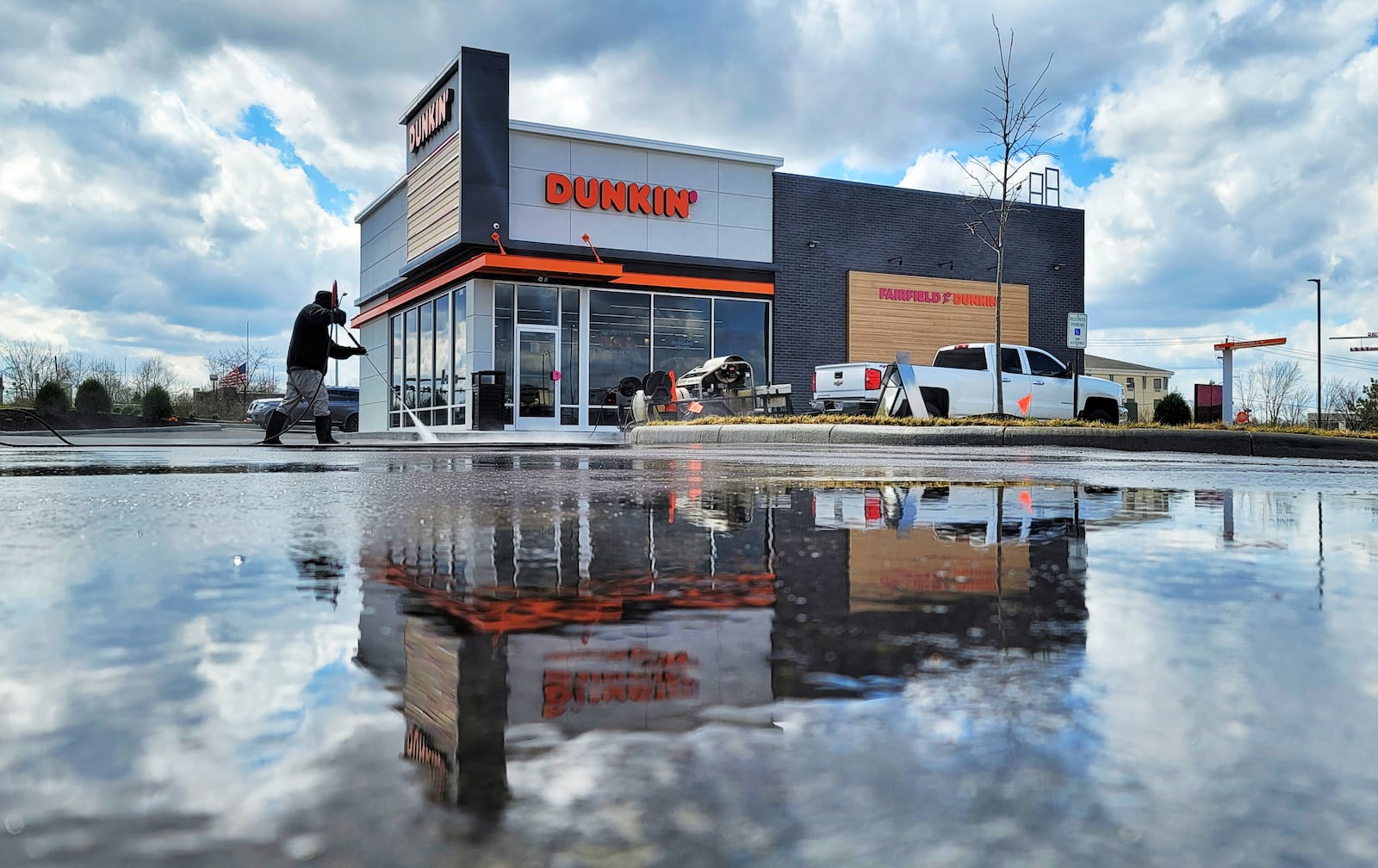 A Dunkin' opened Thursday morning in Fairfield and features two drive-through lanes and doubles windows to make service faster and more effective, officials said. NICK GRAHAM/STAFF