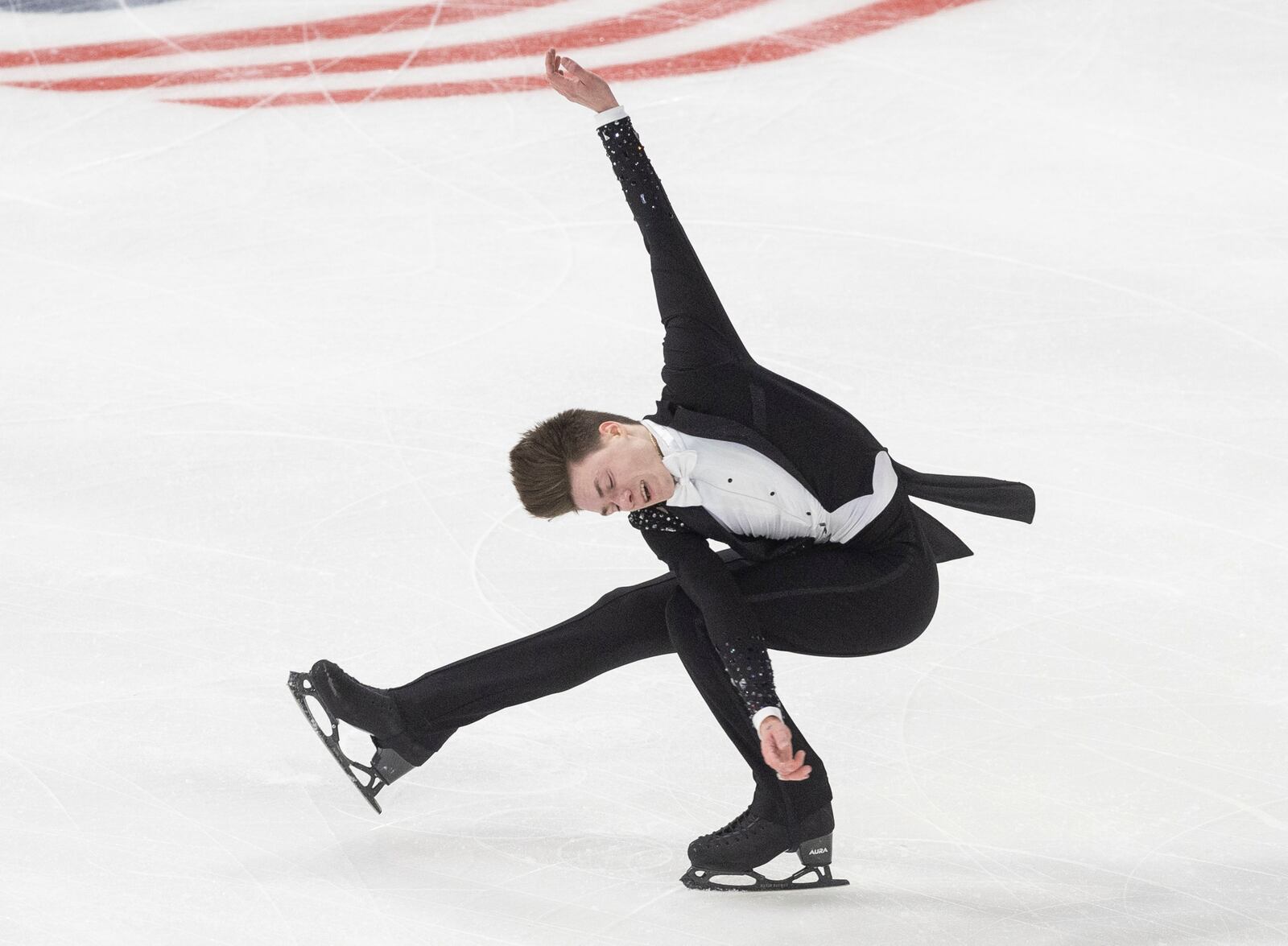 Maxim Naumov performs during the men's free skate competition at the U.S. figure skating championships Saturday, Jan. 25, 2025, in Wichita, Kan. (AP Photo/Travis Heying)