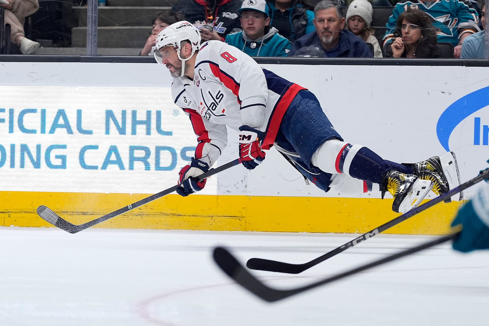 Washington Capitals left wing Alex Ovechkin dives for the puck during the second period against the San Jose Sharks in an NHL hockey game in San Jose, Calif., Saturday, March 15, 2025. (AP Photo/Tony Avelar)