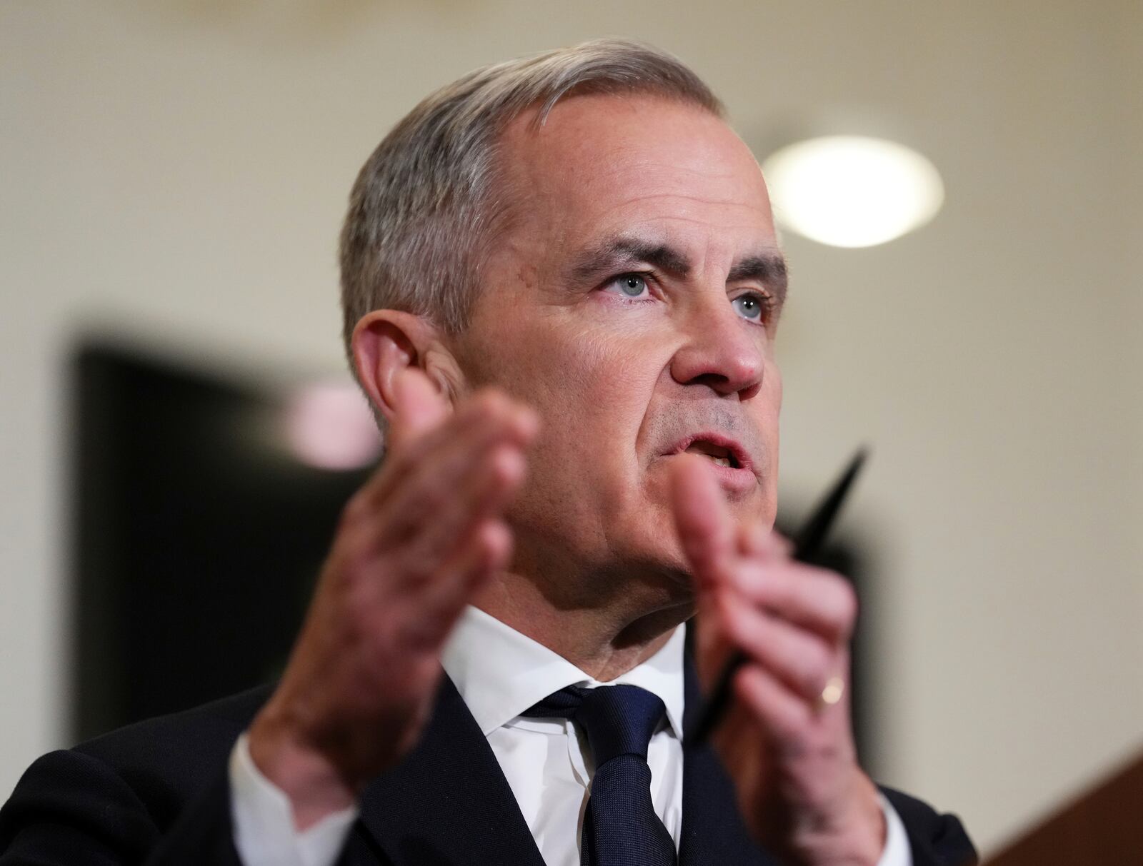 Canada's Prime Minister Mark Carney speaks to the media during a press conference at Canada House in London on Monday, March 17, 2025. (Sean Kilpatrick/The Canadian Press via AP)