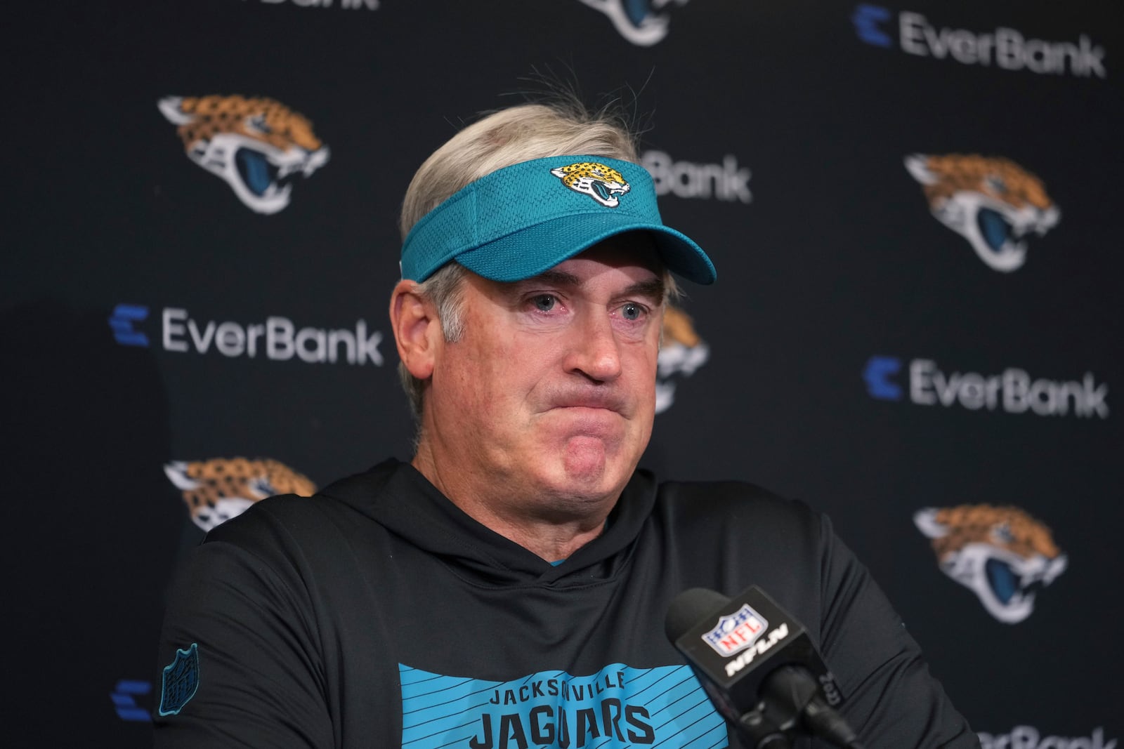 Jacksonville Jaguars head coach Doug Pederson pauses during a news conference after an NFL football game against the Indianapolis Colts, Sunday, Jan. 5, 2025, in Indianapolis. The Colts won 26-23 in overtime. (AP Photo/Michael Conroy)