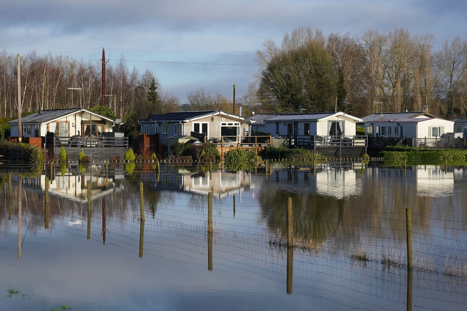 The Little Venice caravan park is seen surrounded by rising flood water in Yalding, Kent, England, Tuesday, Jan. 7, 2025. (Gareth Fuller/PA via AP)