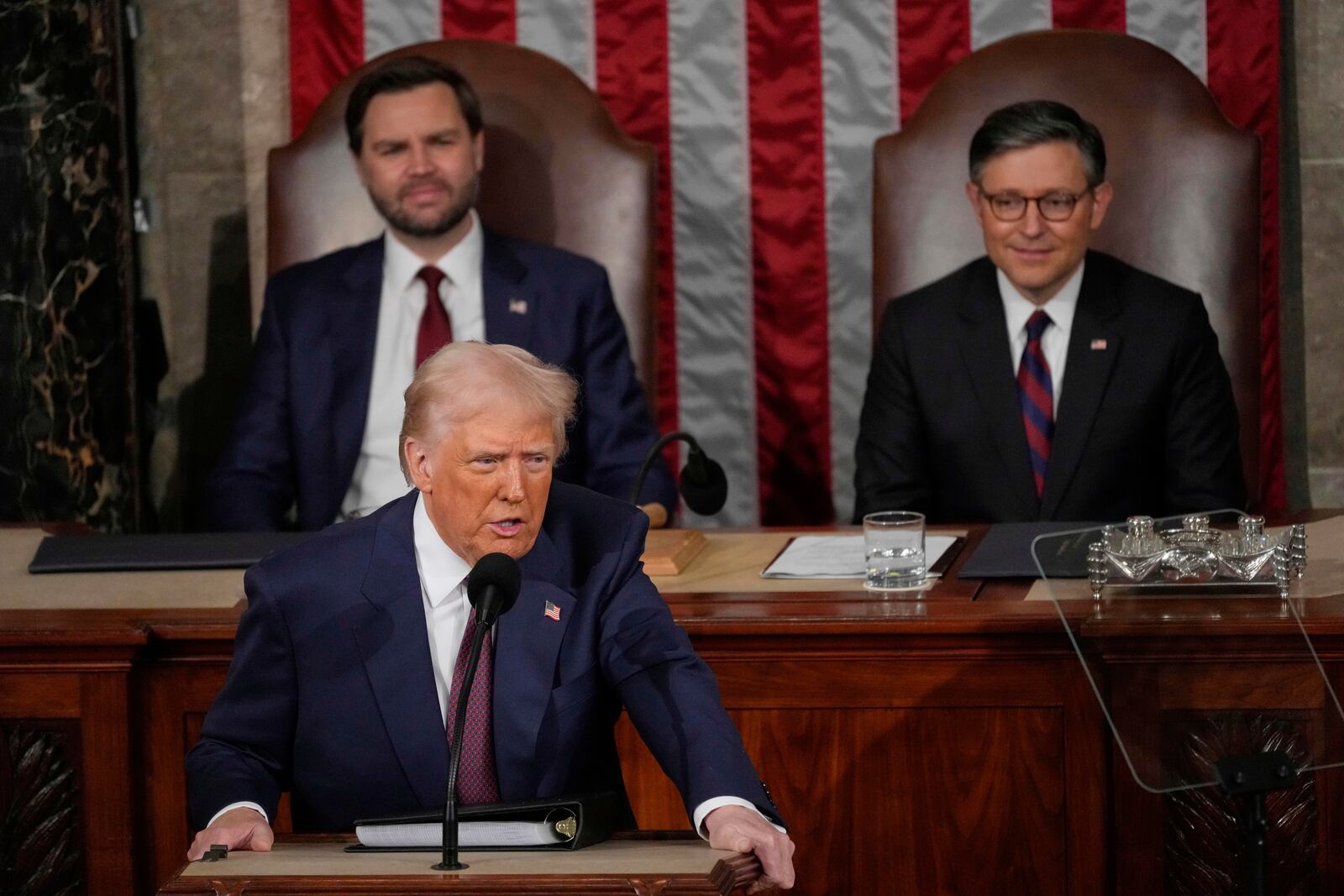 President Donald Trump talks about Greenland as he addresses a joint session of Congress in the House chamber at the U.S. Capitol in Washington, Tuesday, March 4, 2025, as Vice President JD Vance and House Speaker Mike Johnson of La., listen. (AP Photo/Julia Demaree Nikhinson)