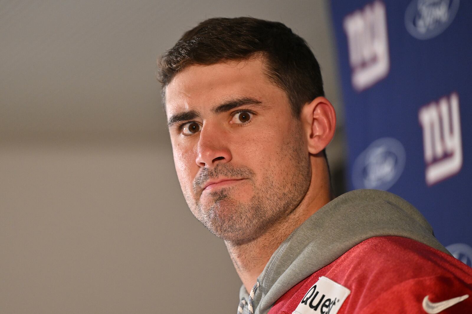 New York Giants quarterback Daniel Jones (8) attends a news conference after a practice session in Munich, Germany, Friday, Nov. 8, 2024. The New York Giants are set to play the Carolina Panthers in an NFL game at the Allianz Arena in Munich on Sunday. (AP Photo/Lennart Preiss)