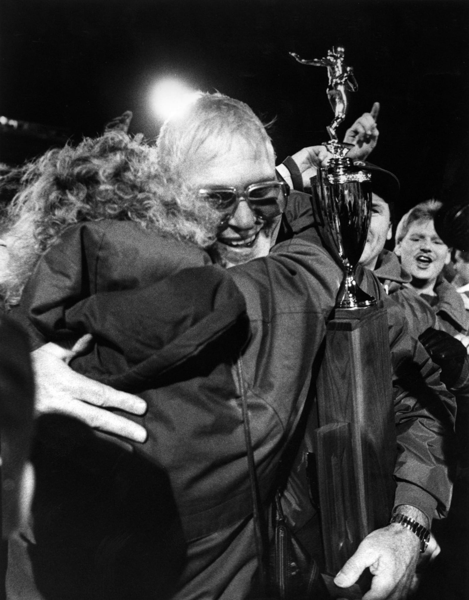 Badin High School football coach Terry Malone is surrounded by happy Ram fans on Nov. 23, 1990, after BHS defeated Richfield Revere 16-6 in the Division III state championship game at Paul Brown Tiger Stadium in Massillon. JOURNAL-NEWS FILE PHOTO