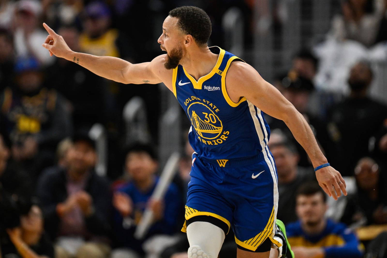 Golden State Warriors guard Stephen Curry (30) celebrates a three-point basket during the first half of an NBA basketball game against the Los Angeles Lakers, Wednesday, Dec. 25, 2024, in San Francisco. (AP Photo/Eakin Howard)