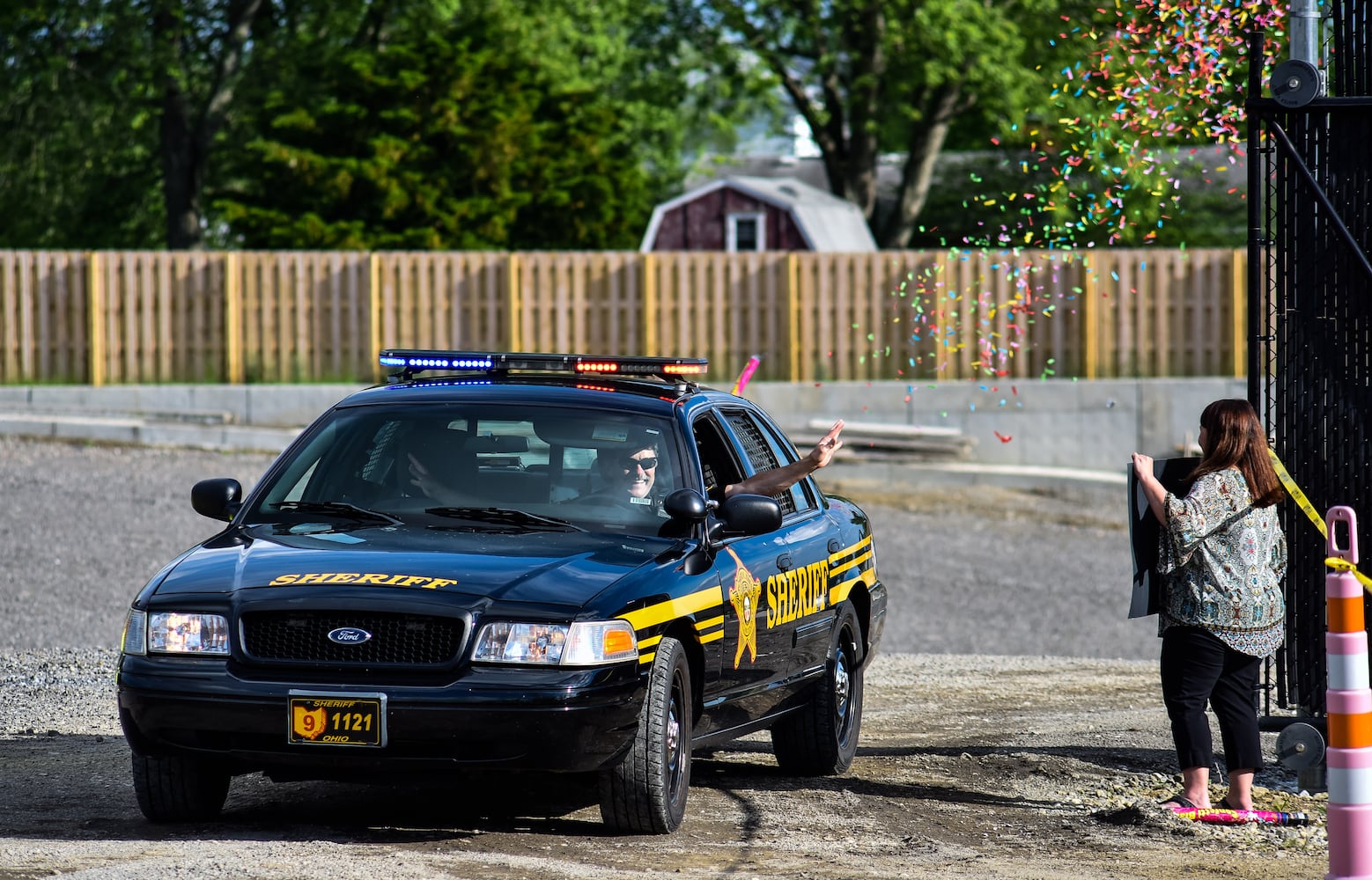 Madison High School drive-thru graduation ceremony at Land of Illusion